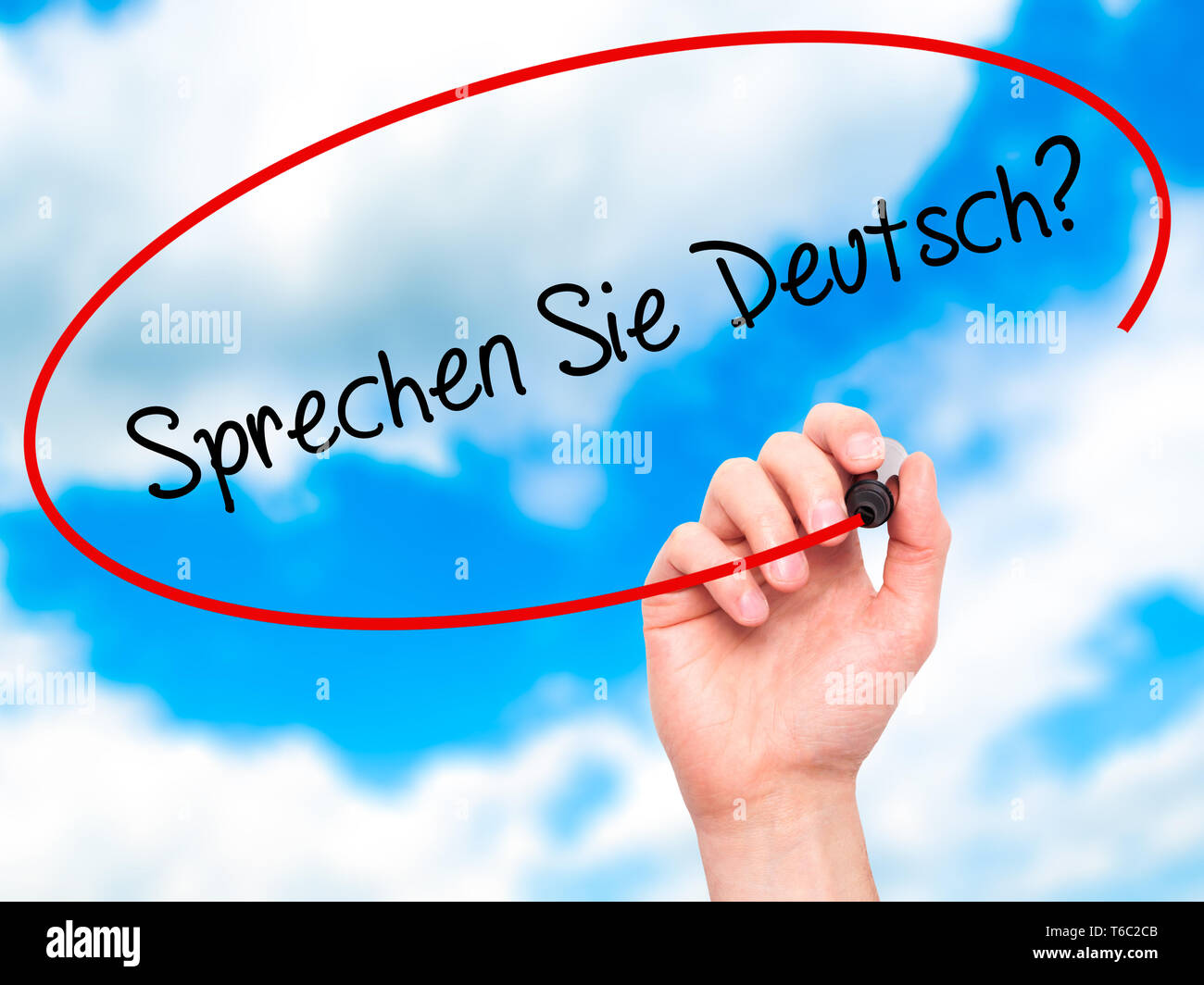 Man Hand writing quot;Sprechen Sie Deutsch?quot; (In German - Do you speak German?) with black marker on visual screen Stock Photo