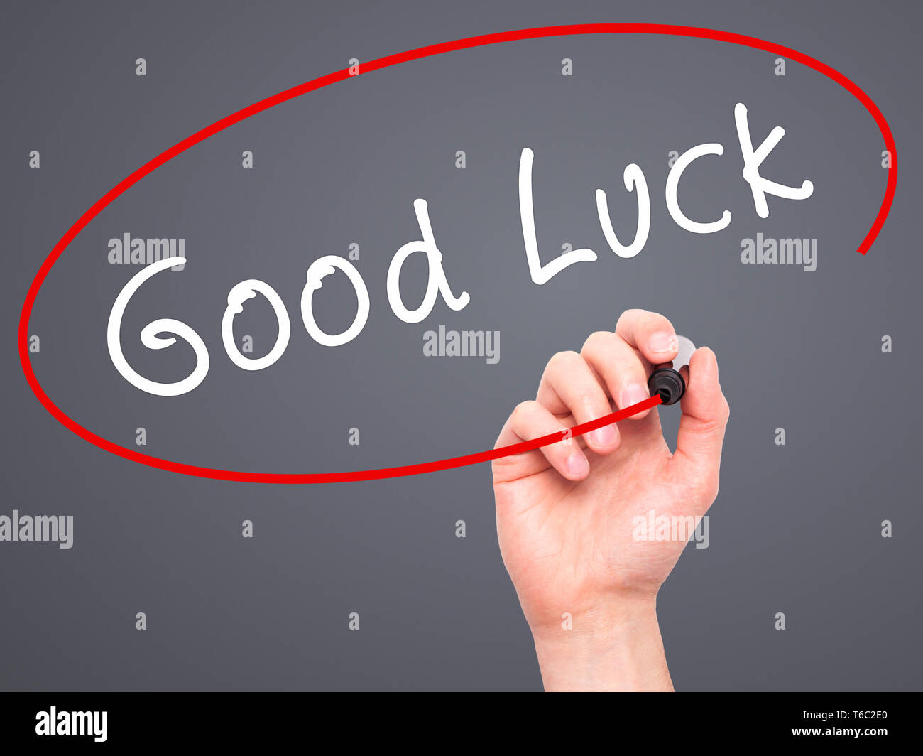 Man Hand writing Good Luck with marker on transparent wipe board Stock Photo