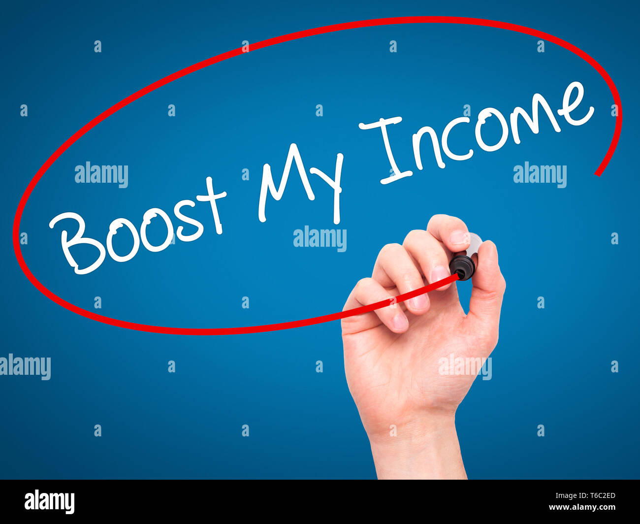 Man Hand writing Boost My Income  with black marker on visual screen Stock Photo
