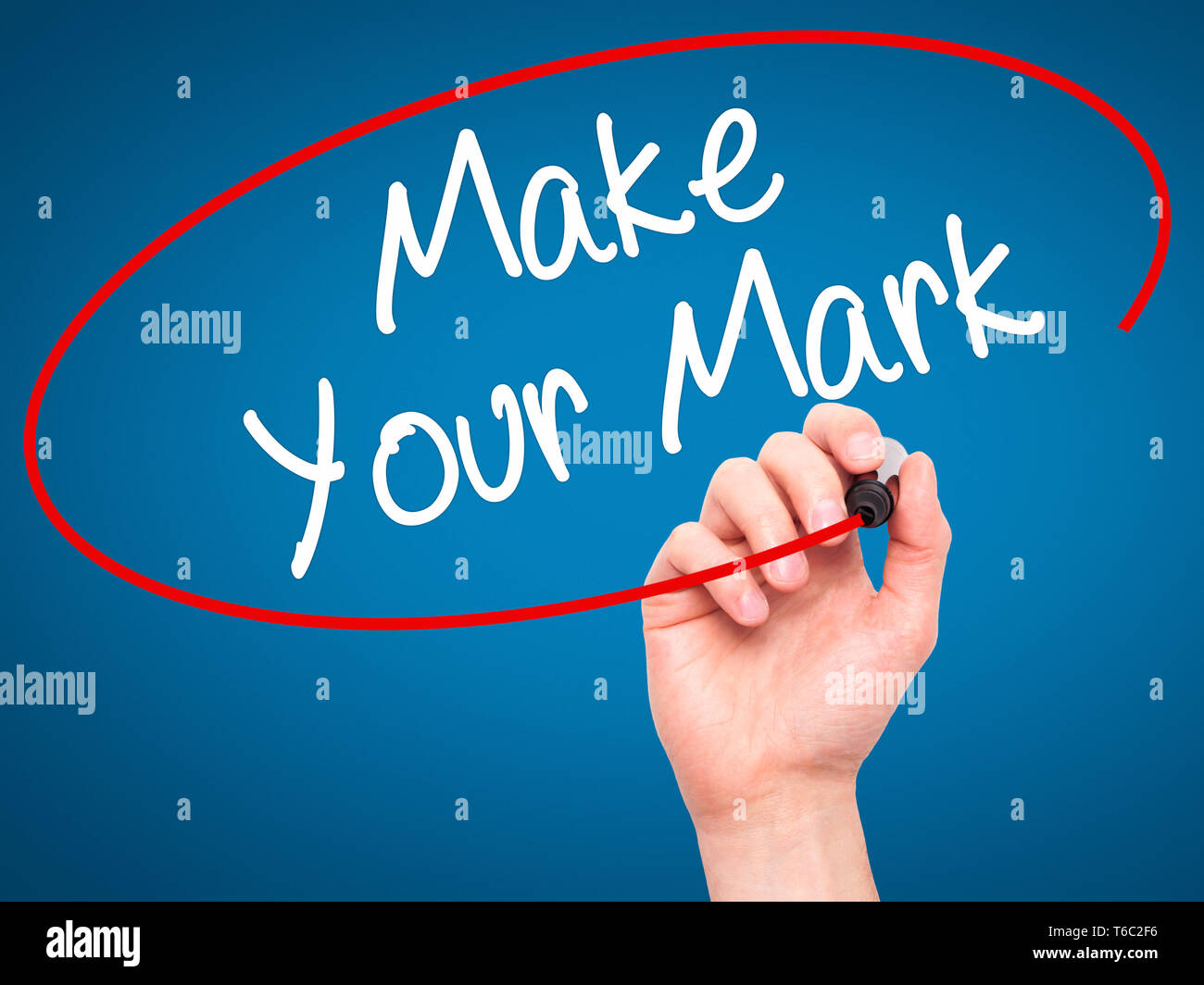 Man Hand writing Make Your Mark with black marker on visual screen Stock Photo