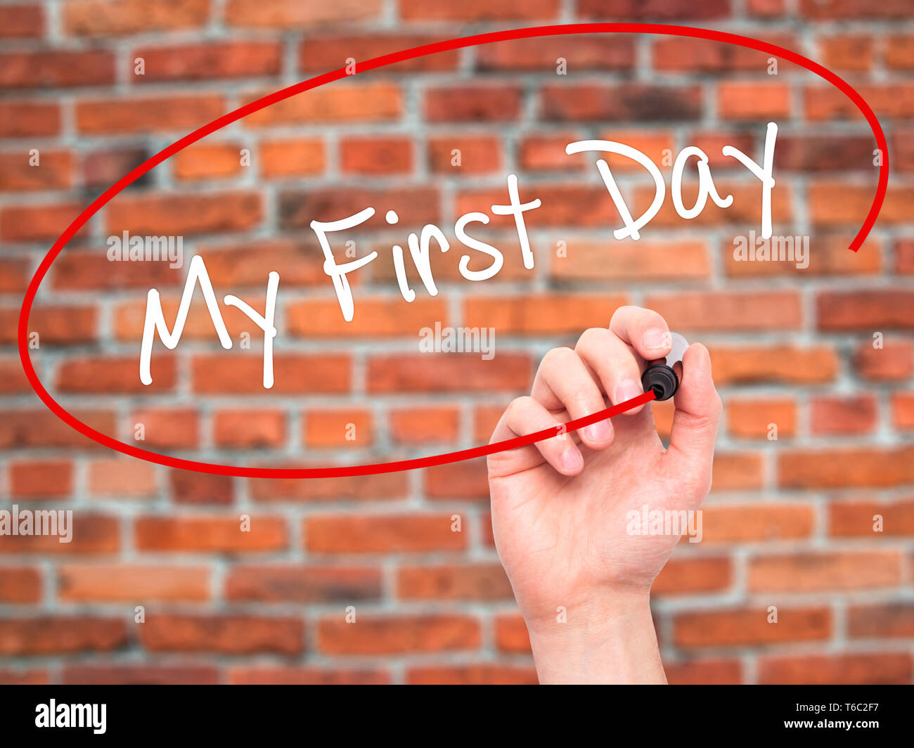 Man Hand writing My First Day with black marker on visual screen Stock Photo