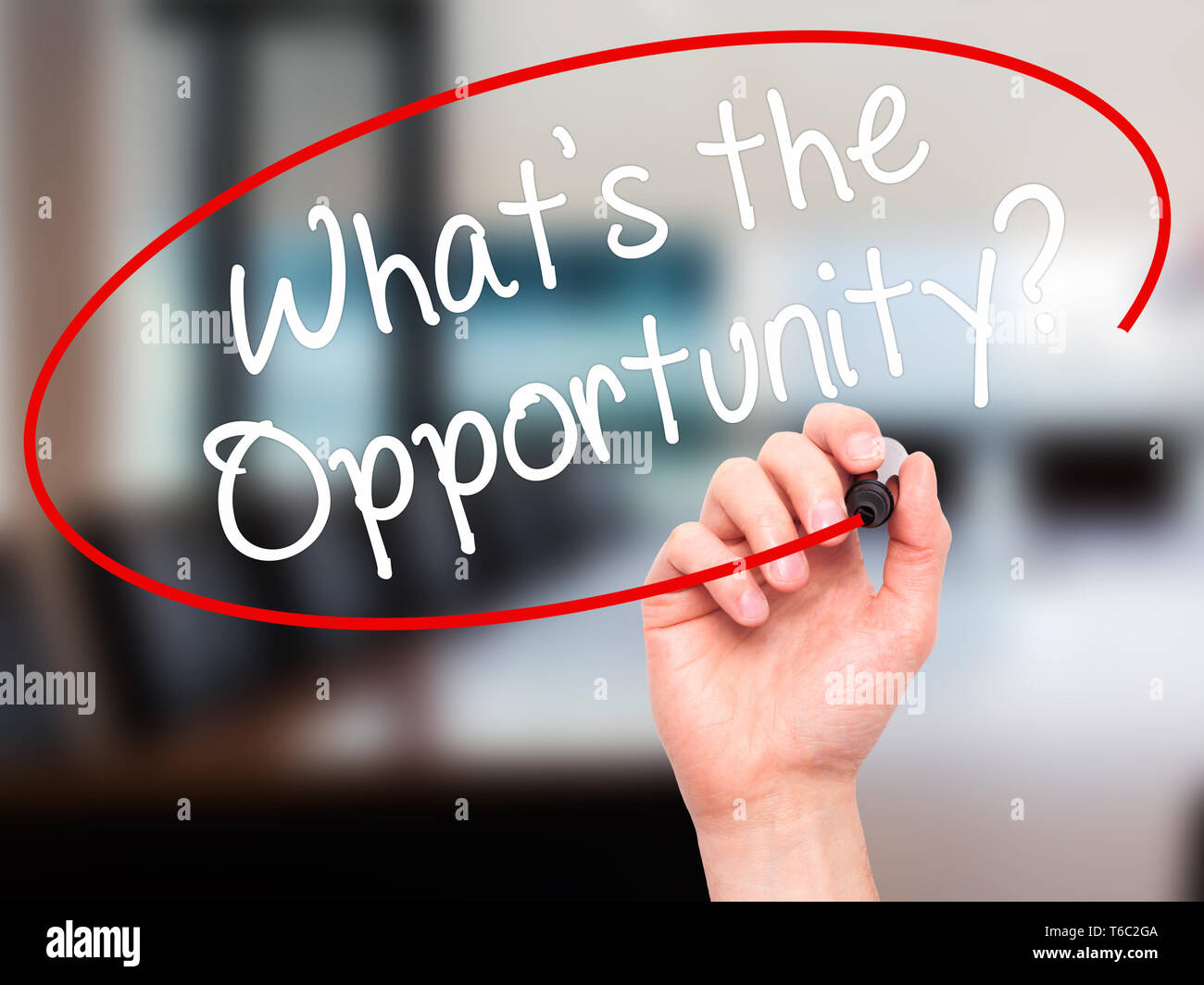 Man Hand writing What's the Opportunity?  with black marker on visual screen Stock Photo