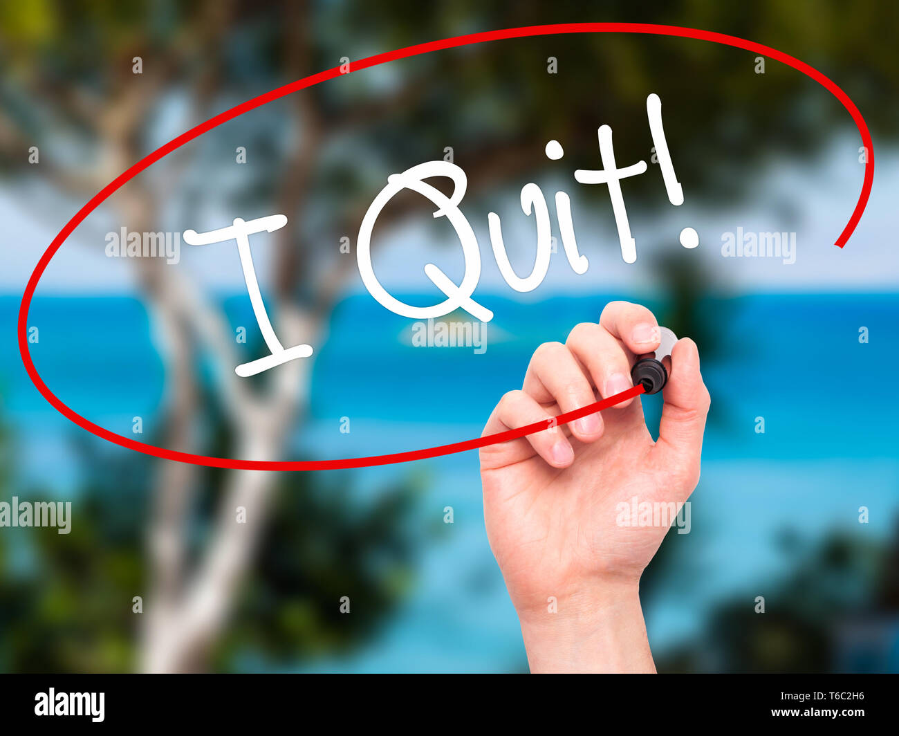 Man Hand writing I Quit! with black marker on visual screen Stock Photo