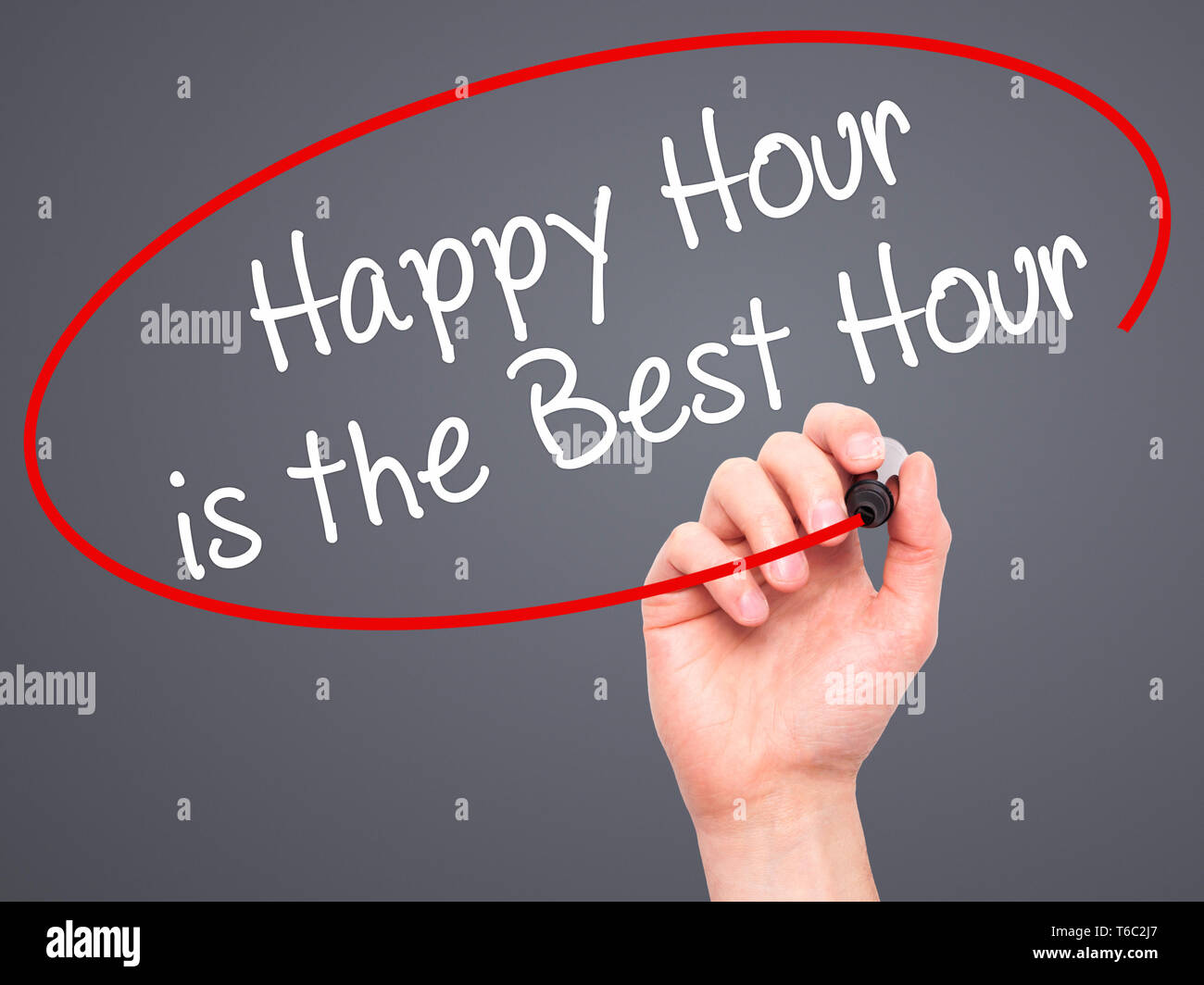 Man Hand writing Happy Hour is the Best Hour  with black marker on visual screen Stock Photo