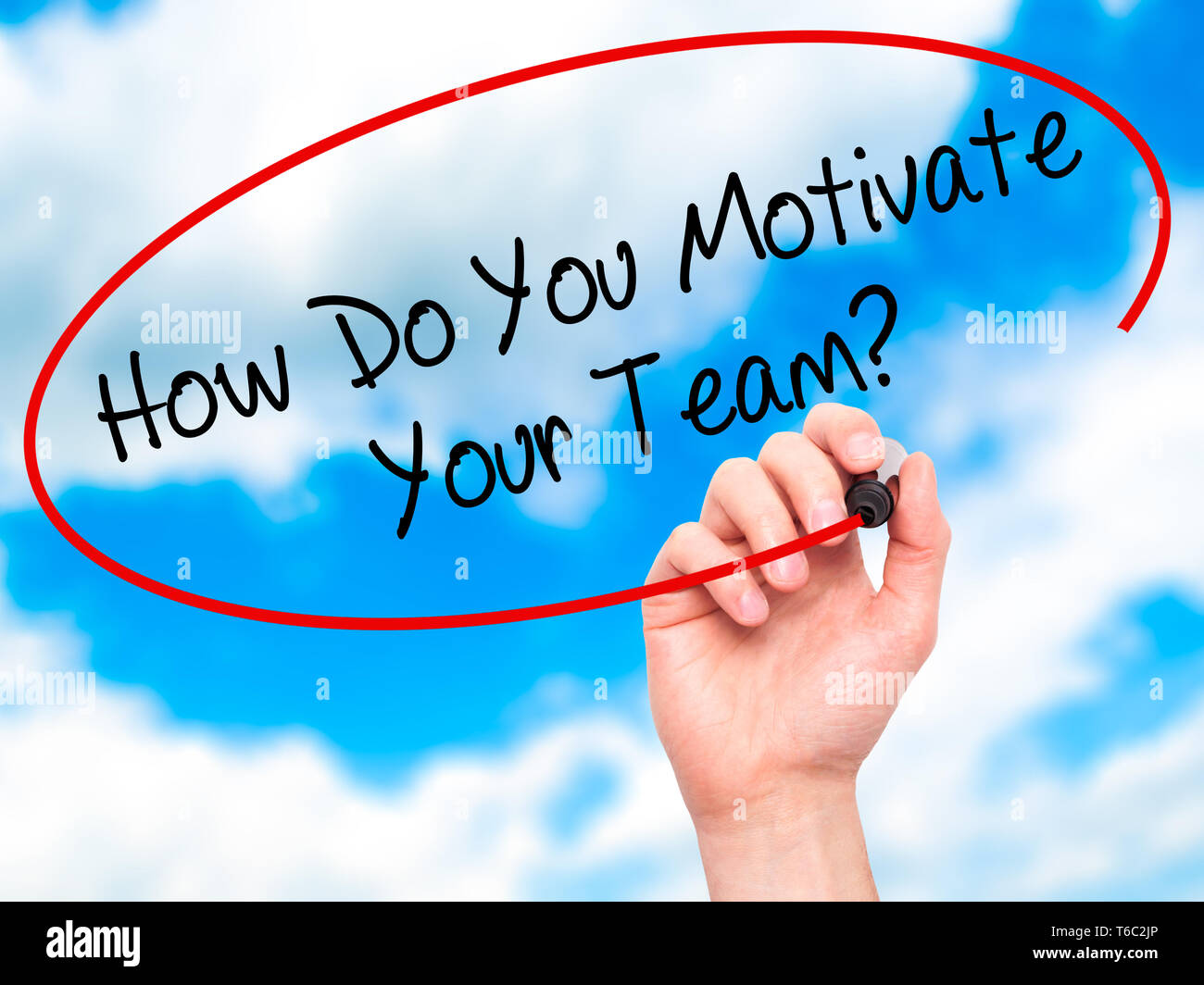 Man Hand writing How Do You Motivate Your Team? with black marker on visual screen Stock Photo