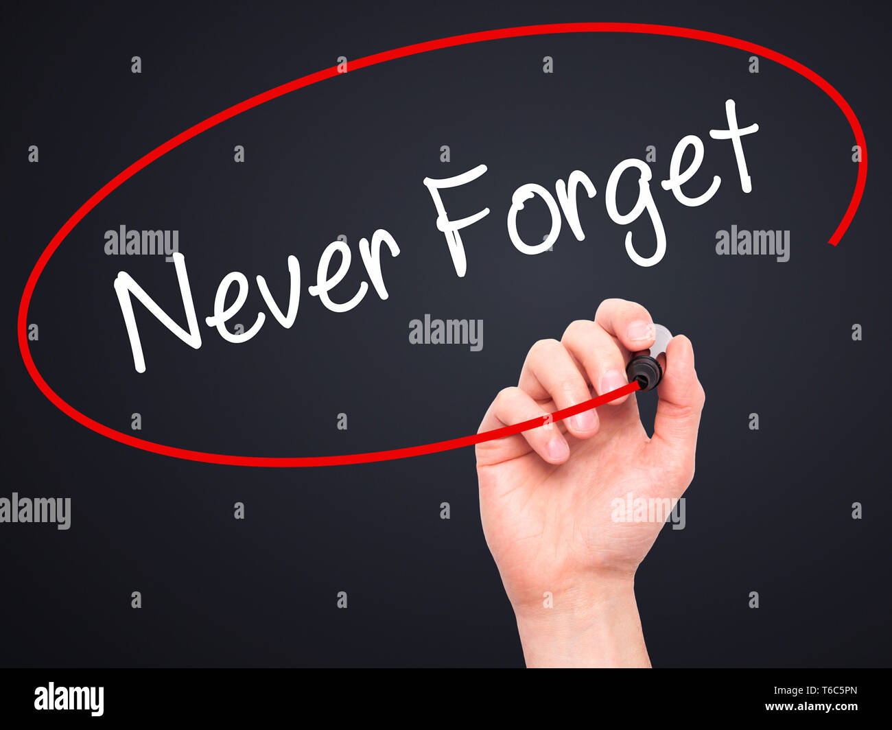 Man Hand writing Never Forget  with black marker on visual screen Stock Photo