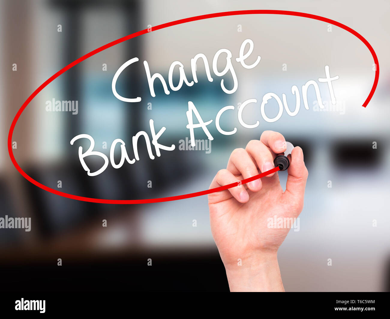 Man Hand writing Change Bank Account with black marker on visual screen
