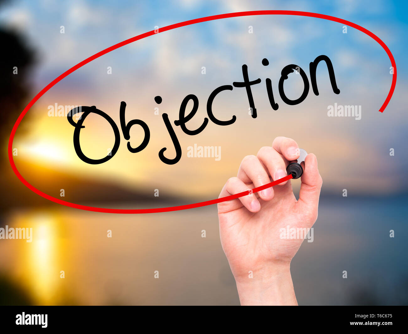 Man Hand writing Objection with black marker on visual screen Stock Photo