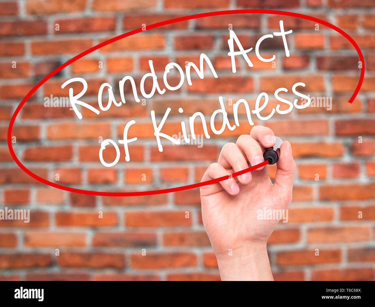 Man Hand writing Random Act of Kindness with black marker on visual screen Stock Photo
