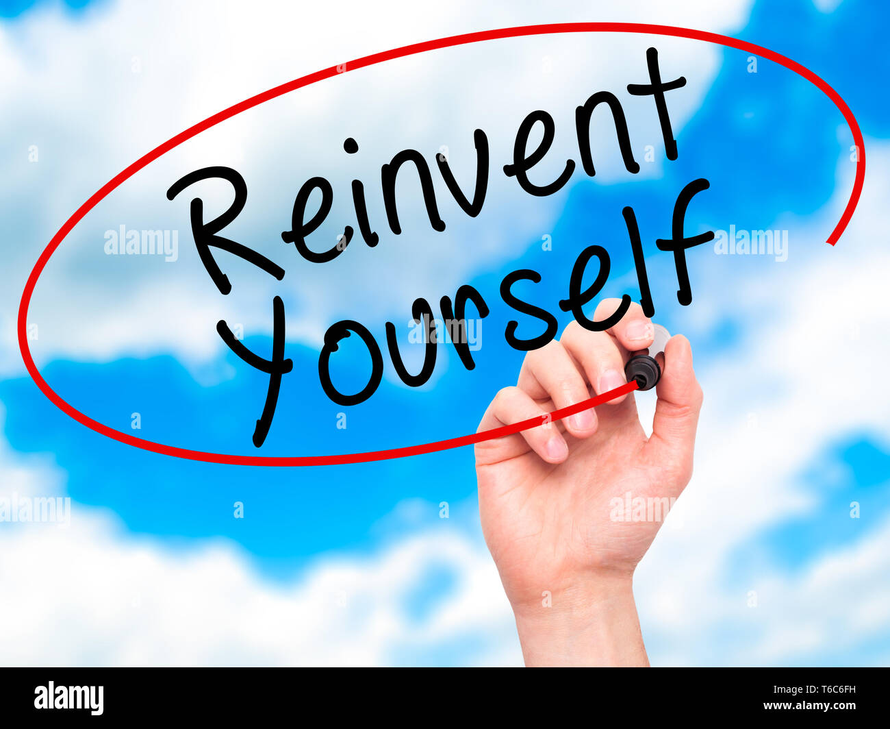 Reinvent Sign Man Hand writing Reinvent Yourself with black marker on visual screen ...