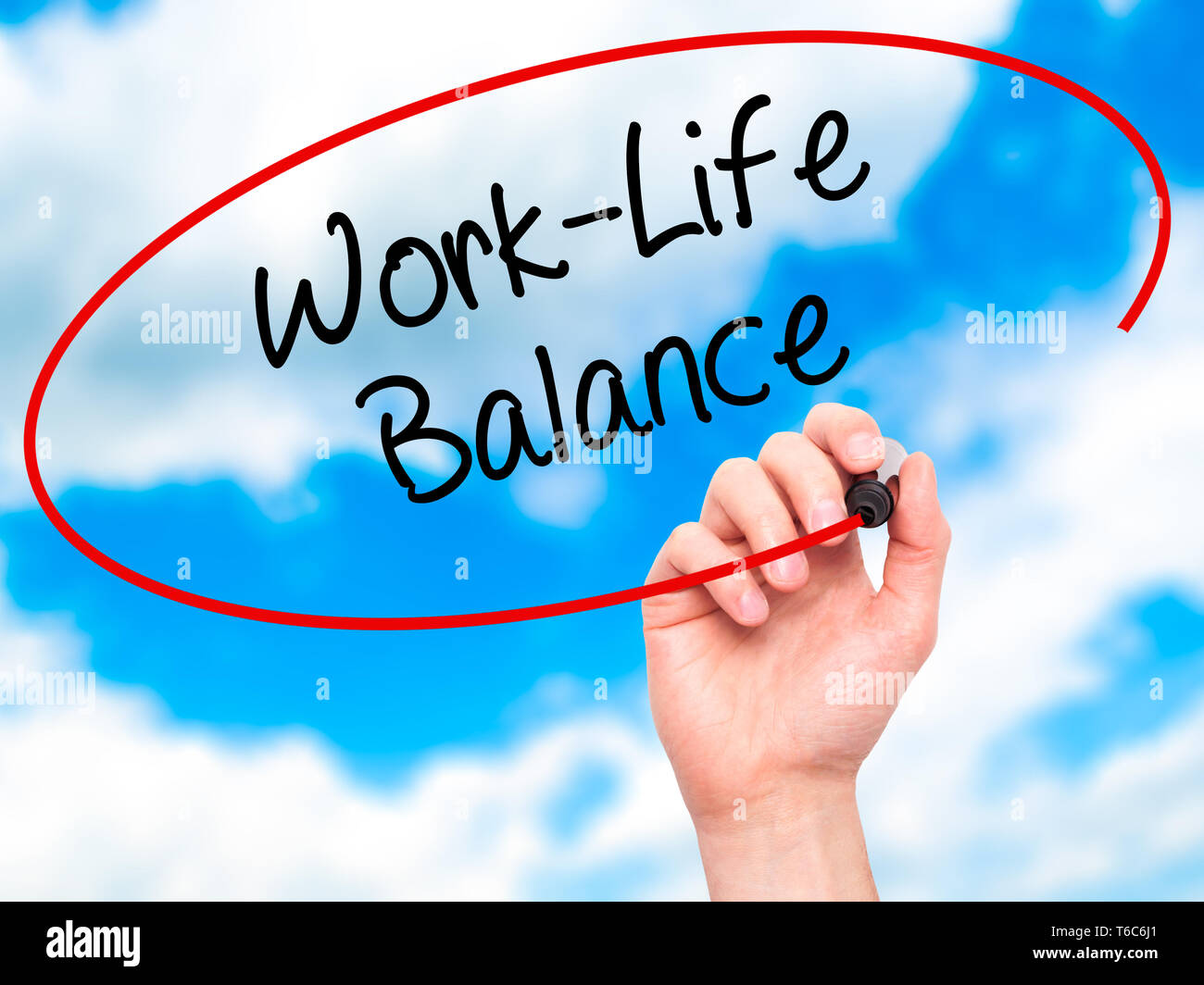 Man Hand writing Work-Life Balance with black marker on visual screen ...