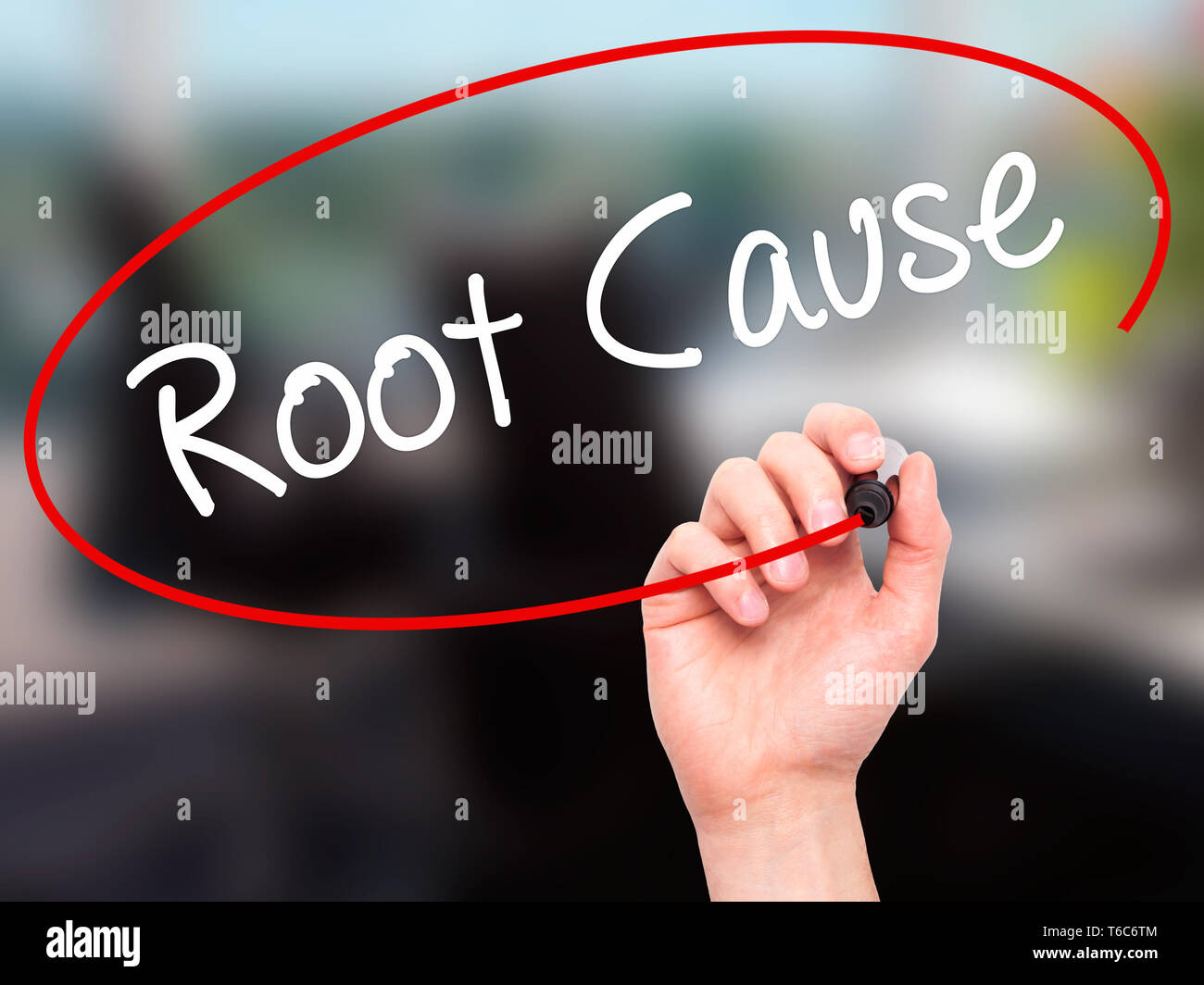 Man Hand writing Root Cause  with black marker on visual screen Stock Photo