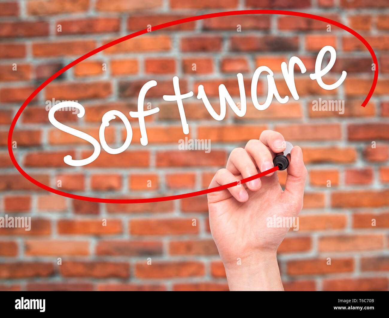 Man Hand writing Software  with black marker on visual screen. Stock Photo