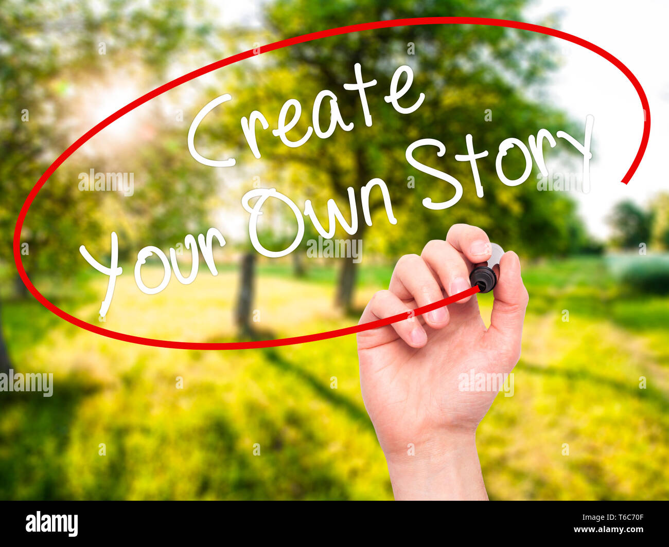 Man Hand writing Create Your Own Story with black marker on visual ...