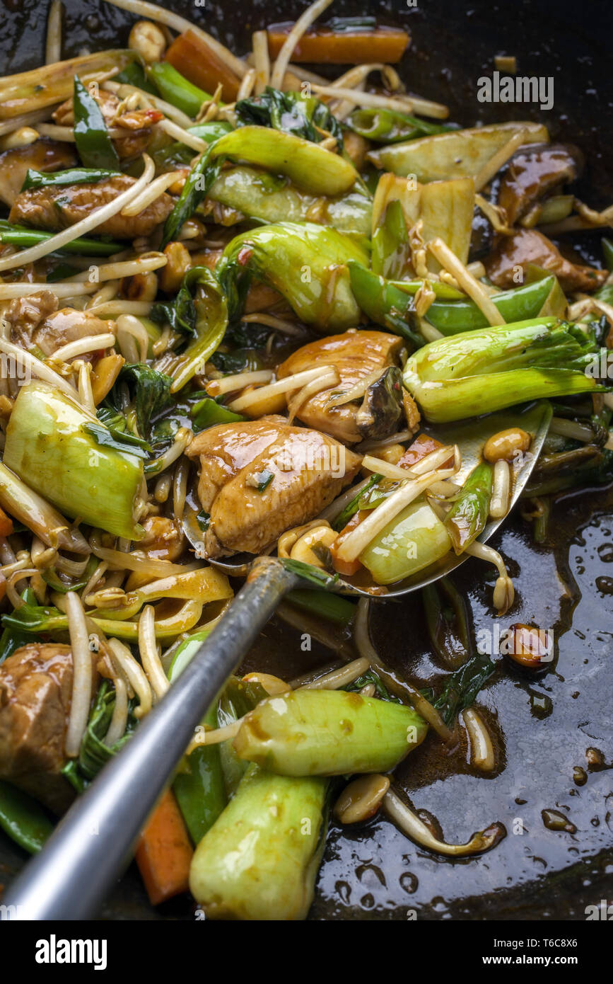 Traditional stir fried Chicken Gung Bao with Vegetable as closeup in Wok Stock Photo Alamy