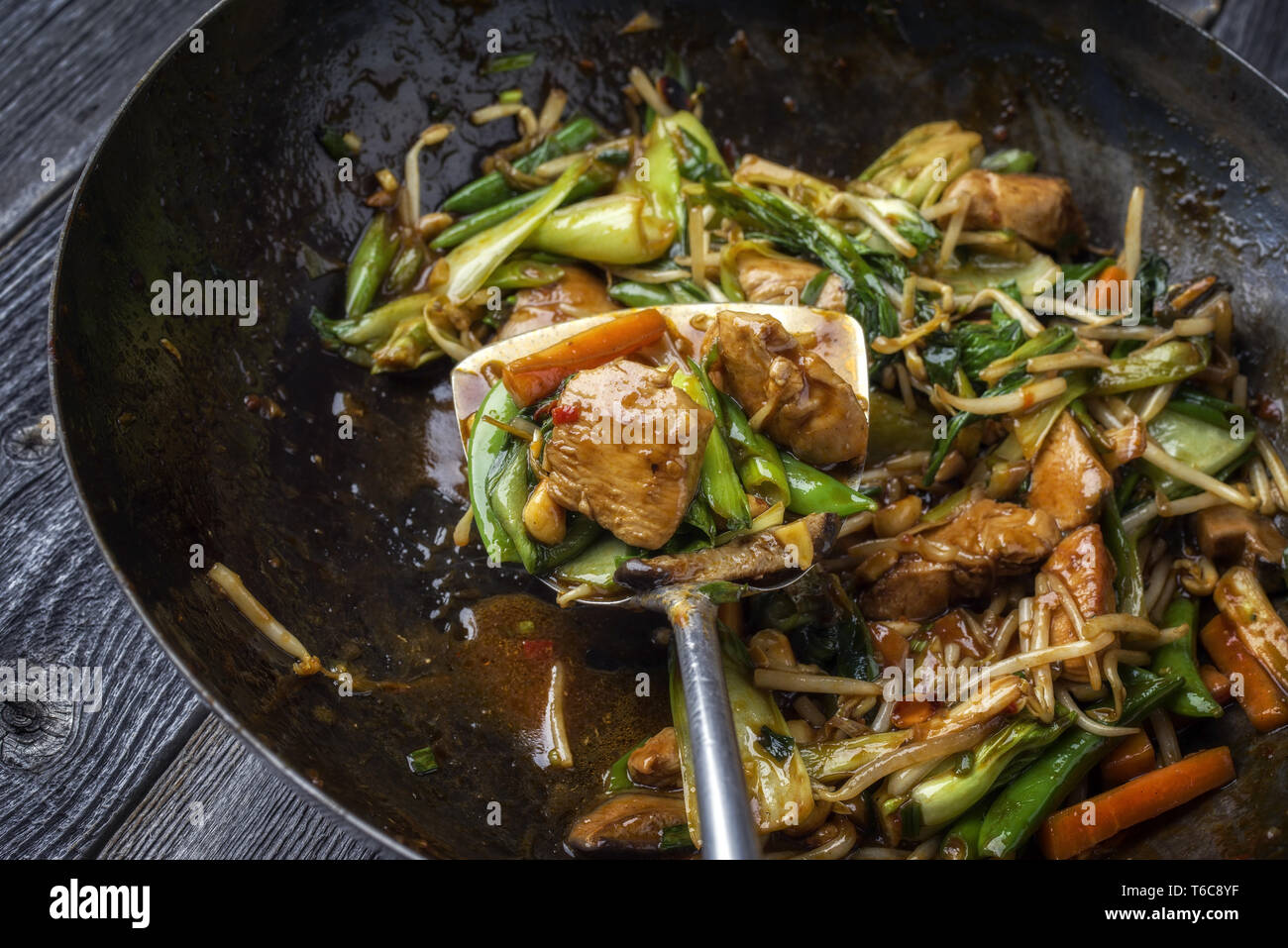 Traditional stir fried Chicken Gung Bao with Vegetable as closeup in