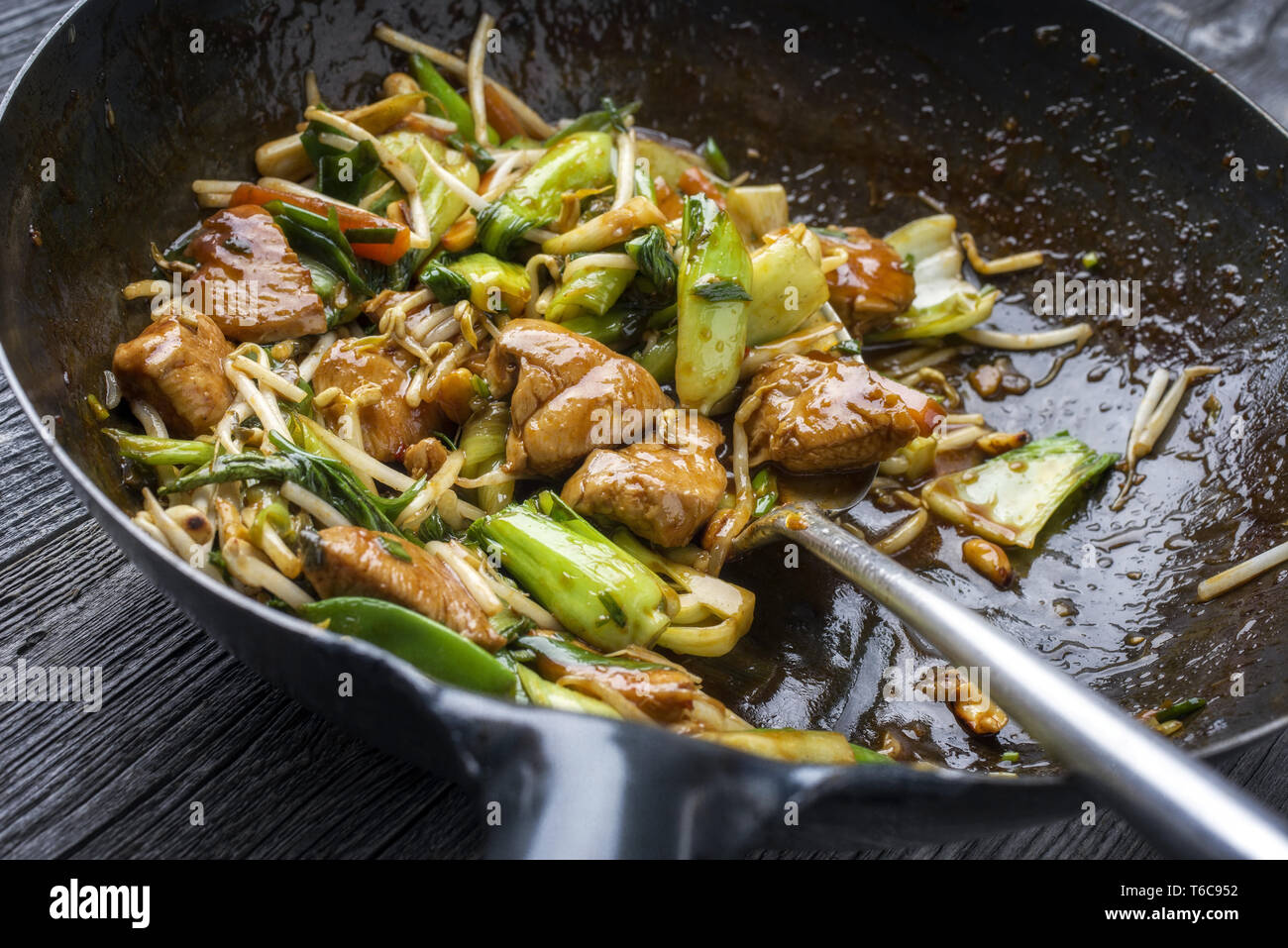 Traditional stir fried Chicken Gung Bao with Vegetable as closeup in Wok Stock Photo Alamy