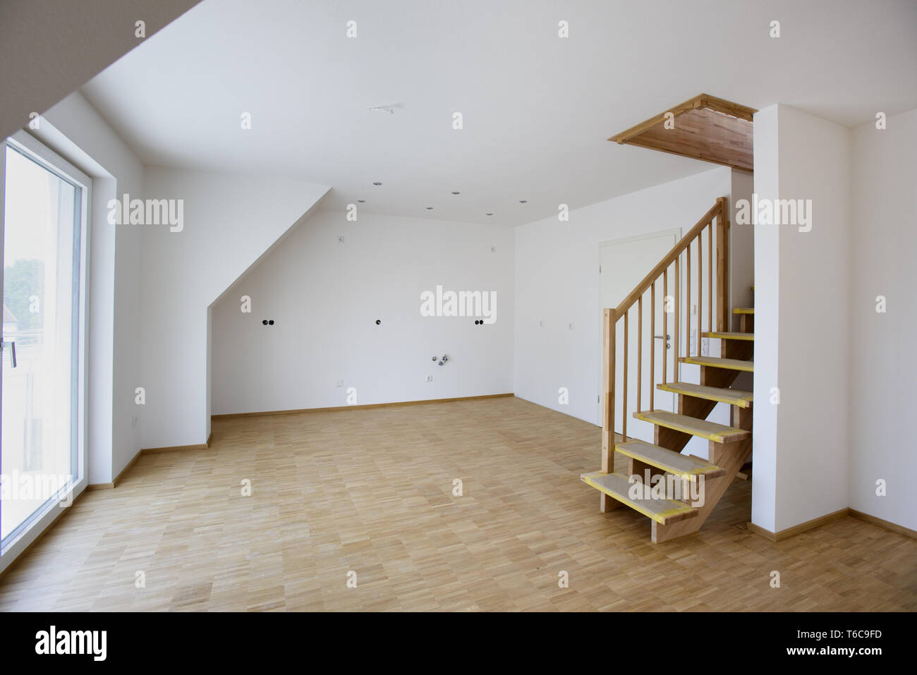 empty room with white walls in new built house in construction Stock Photo