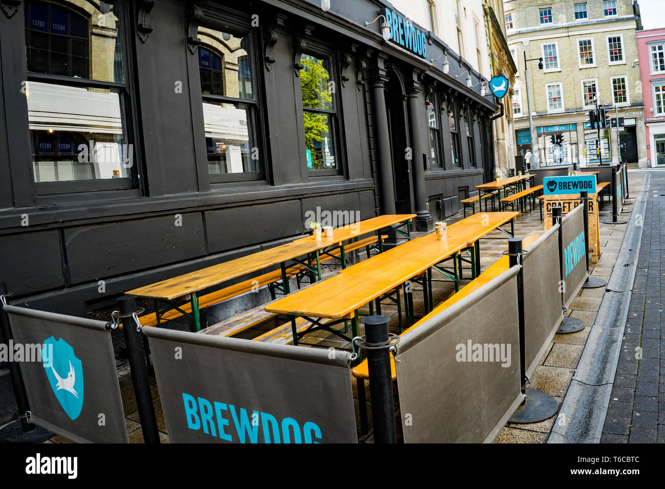 The entrance and outside seating area of Brew Dog, a popular drinking hole located in Queen Street, Norwich, Norfolk. Captured on a dull, overcast and Stock Photo