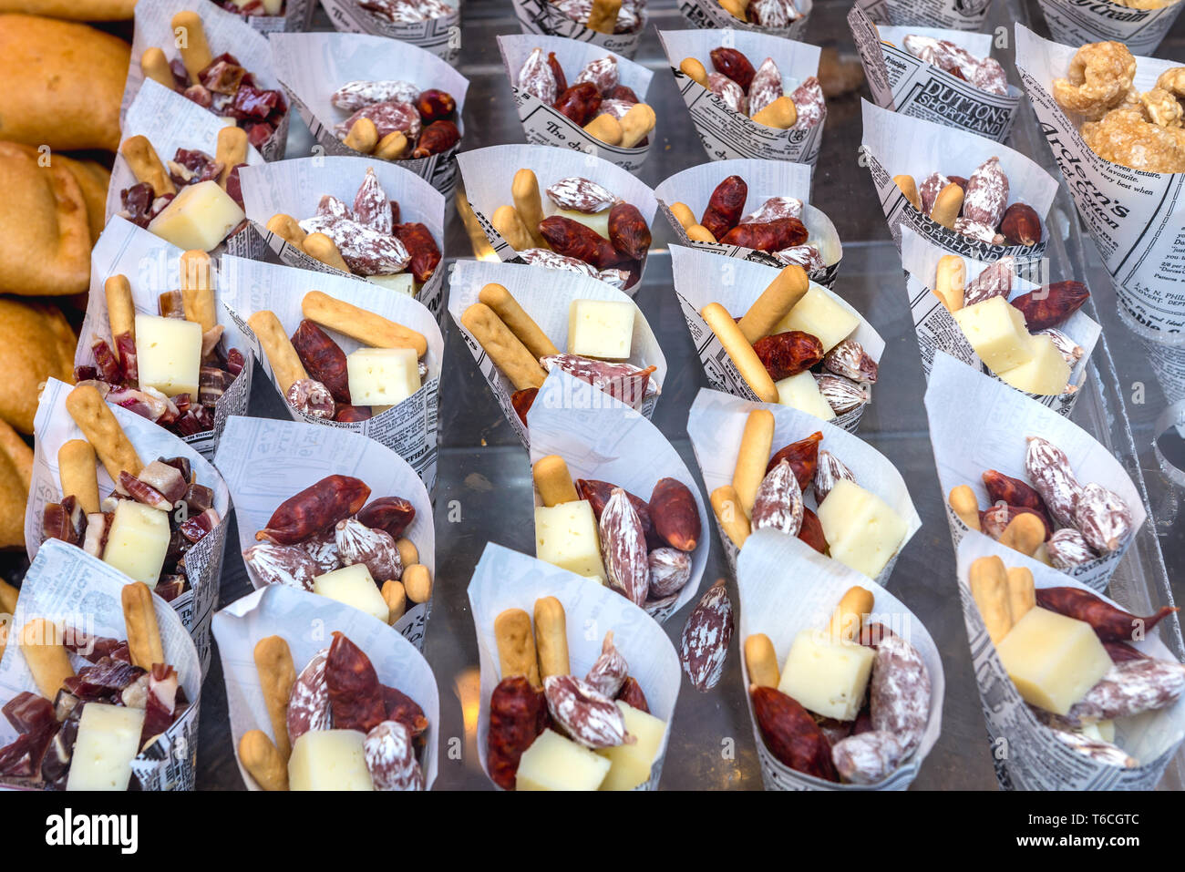 Cones with chorizo, crackers and cheese in small bar in Madrid, Spain
