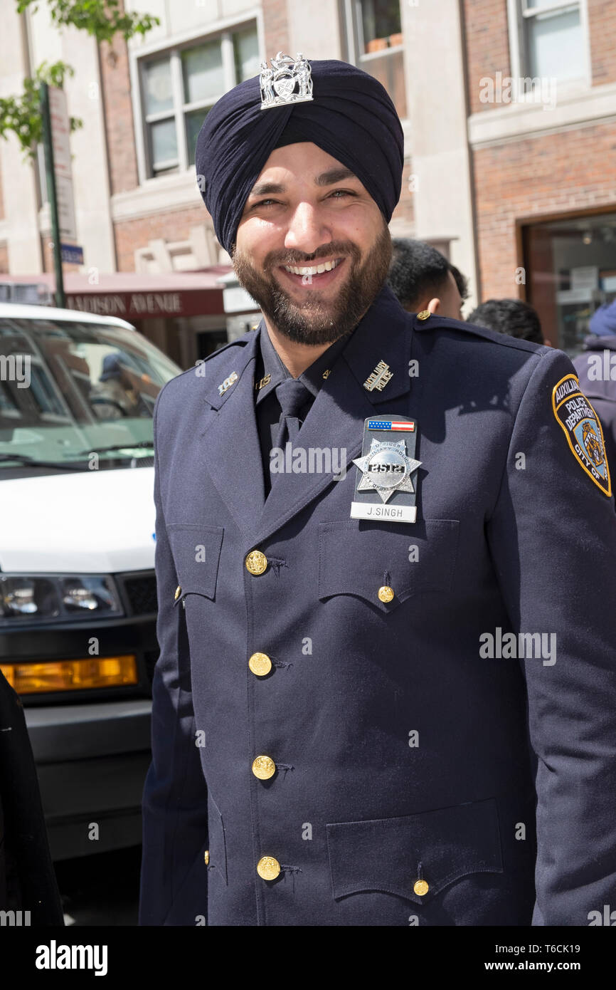 Posed portrait of a Sikh auxiliary policeman in a turban at the Sikh Day Parade in Manhattan, New York City. Stock Photo