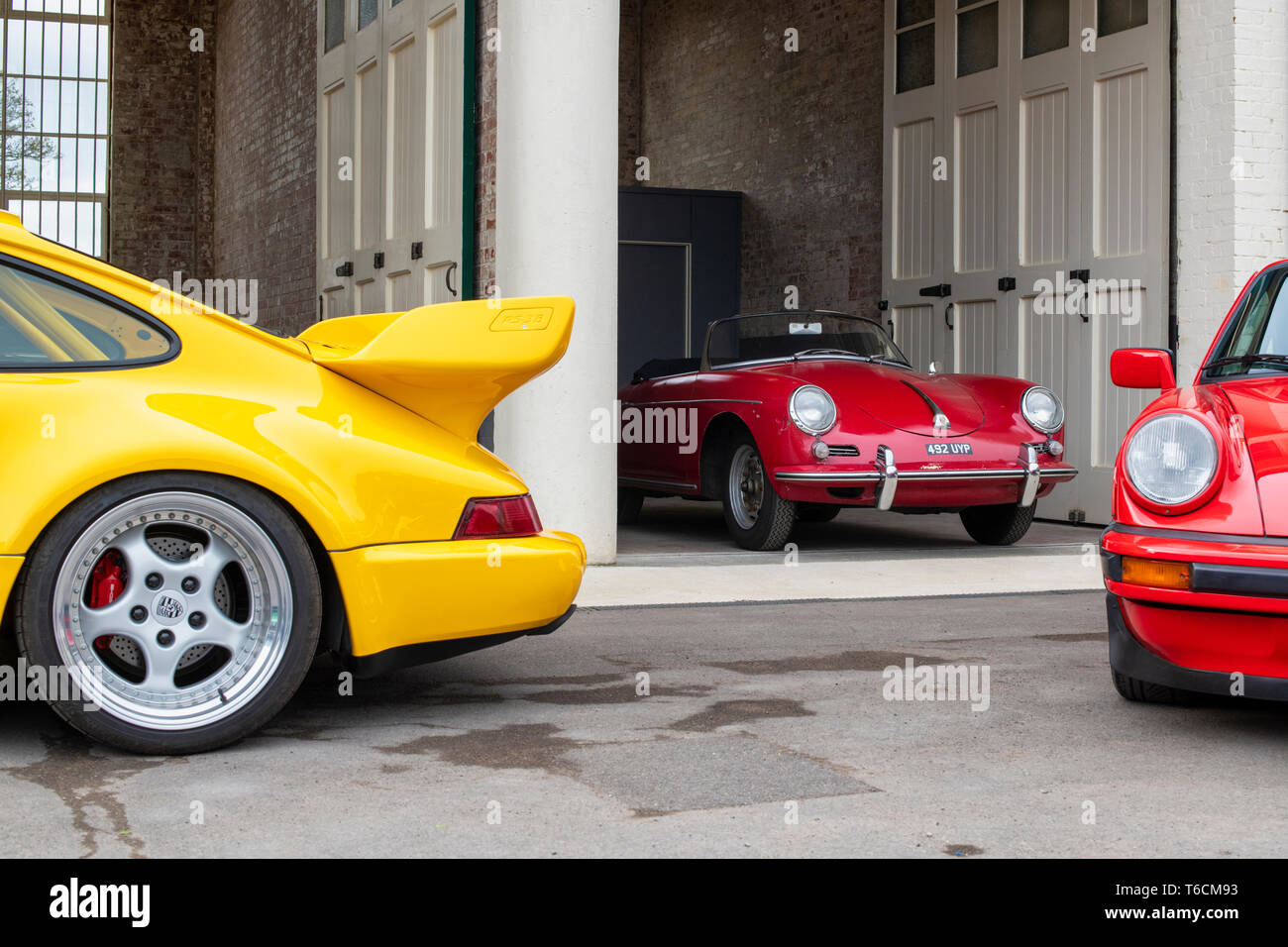 1960 Porsche 356B Roadster car in a garage at Bicester heritage centre, 'Drive It Day'. Bicester, Oxfordshire, England Stock Photo