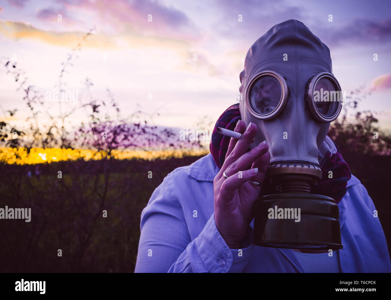 Woman with gas mask and cigarette Stock Photo Alamy