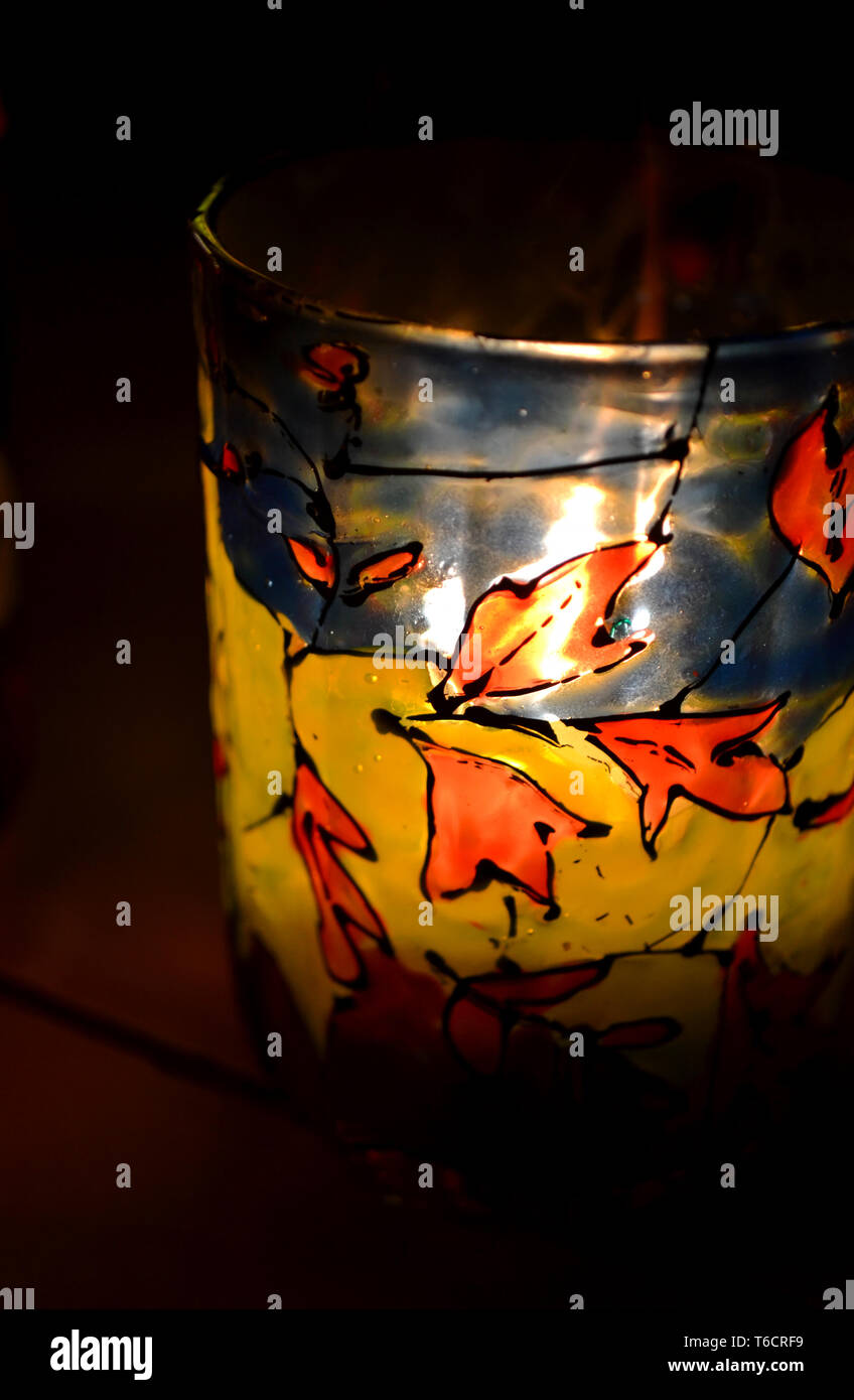 Glass Candle Holder Painted Stained Glass Paints With A Burning Candle Inside Stock Photo Alamy