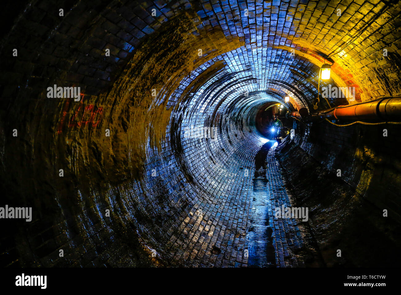 Ruhr area, North Rhine-Westphalia, Germany - Topic picture sewer network transmission, inspection of an old, bricked sewer in need of rehabilitation. Stock Photo