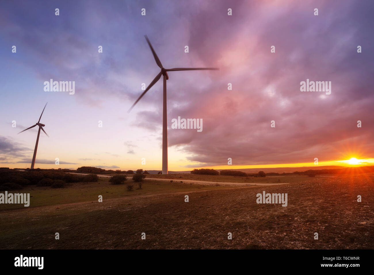 wind turbines silhouette on mountain at sunset Stock Photo - Alamy