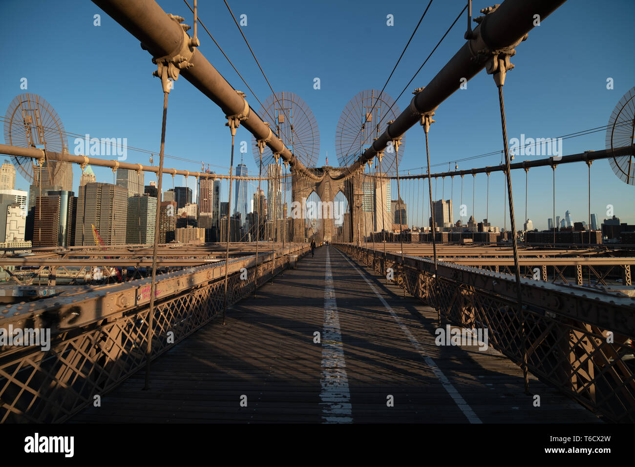 Shot of the Brooklyn Bridge at sunrise, with Manhattan skyline in the ...
