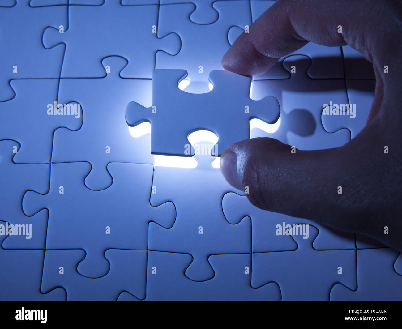Blue jigsaw puzzle. Business solutions, solving problems,science technology  and team building concept Stock Photo - Alamy