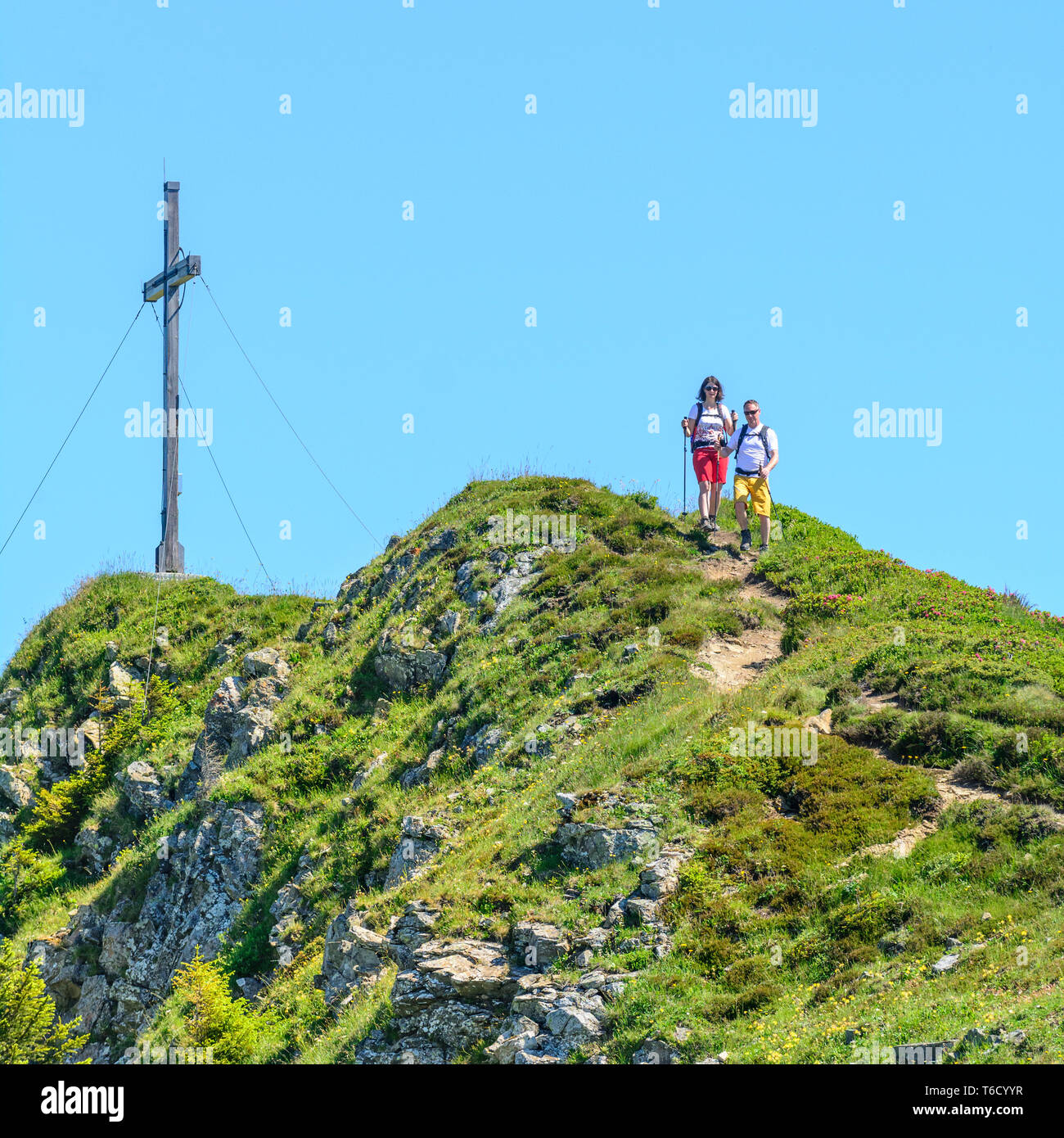 Two hikers in mountain summer in western Austrian Alps Stock Photo