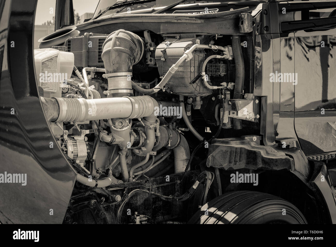 Fullyelectric class 6 delivery truck open hood with engine inside