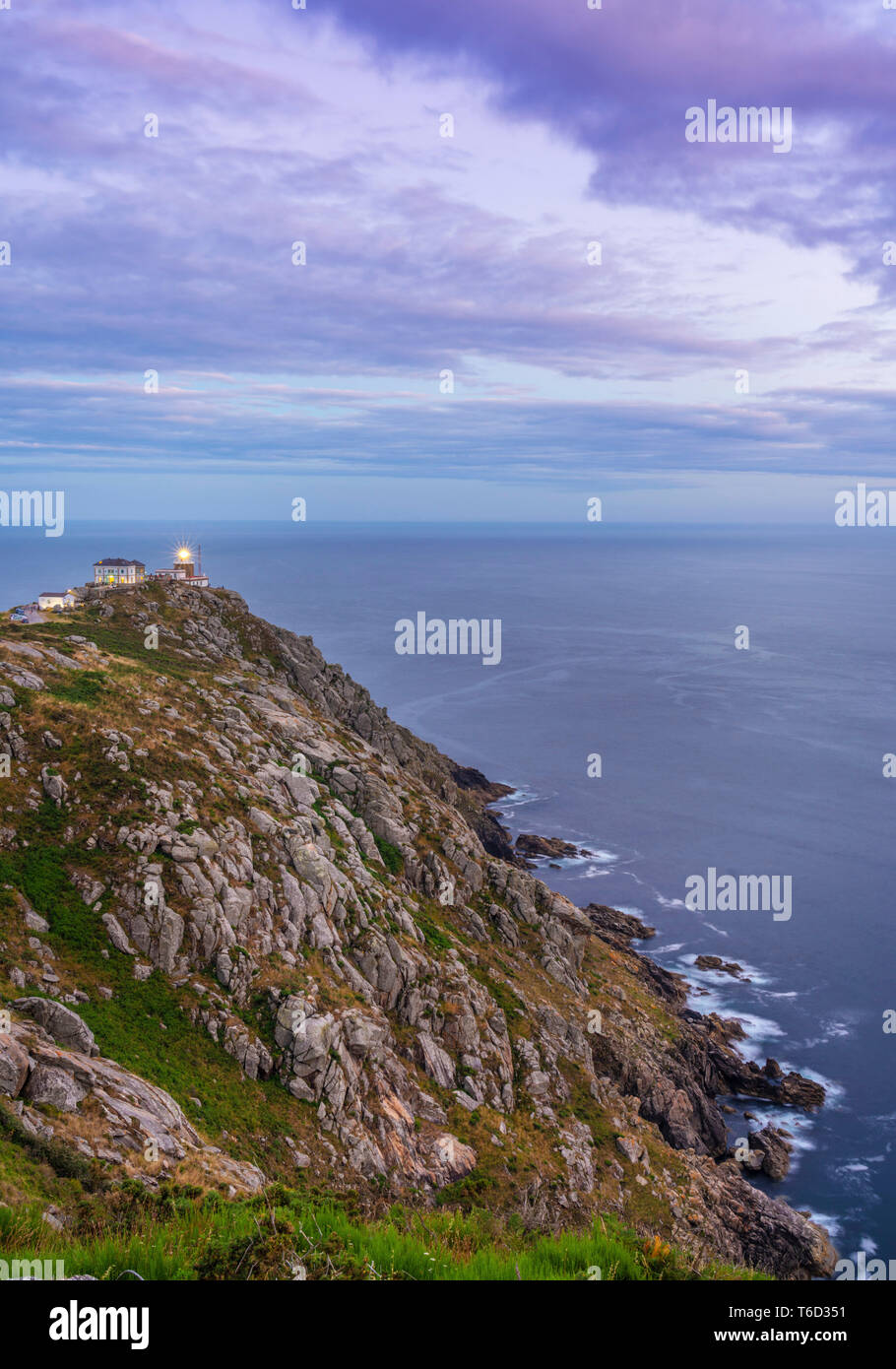 Spain, Galicia, Finisterre, Finisterre lighthouse at dusk Stock Photo
