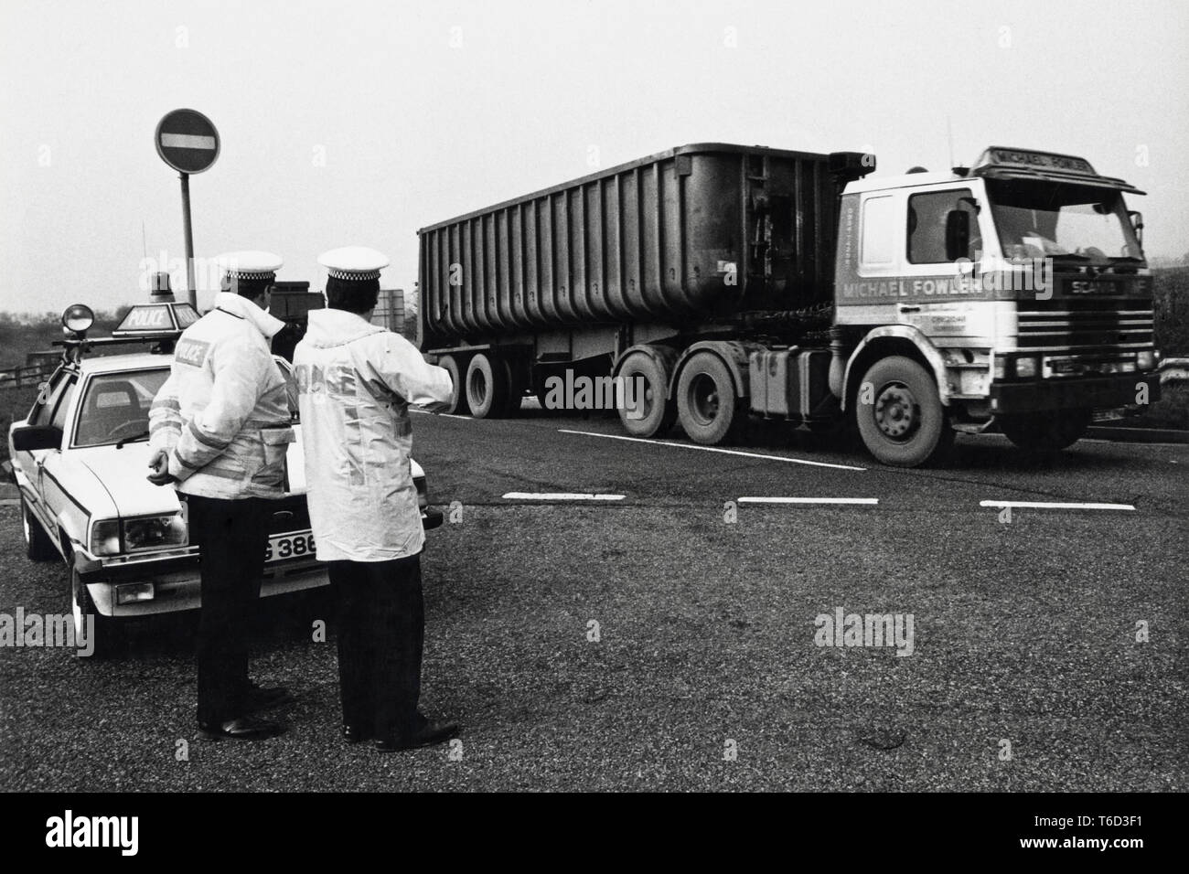 Police block roundabout during 1984 miners strike at Magor Services to allow convoy of lorries through carrying coal & coke bound for Llanwern steelworks Newport South Wales UK Stock Photo