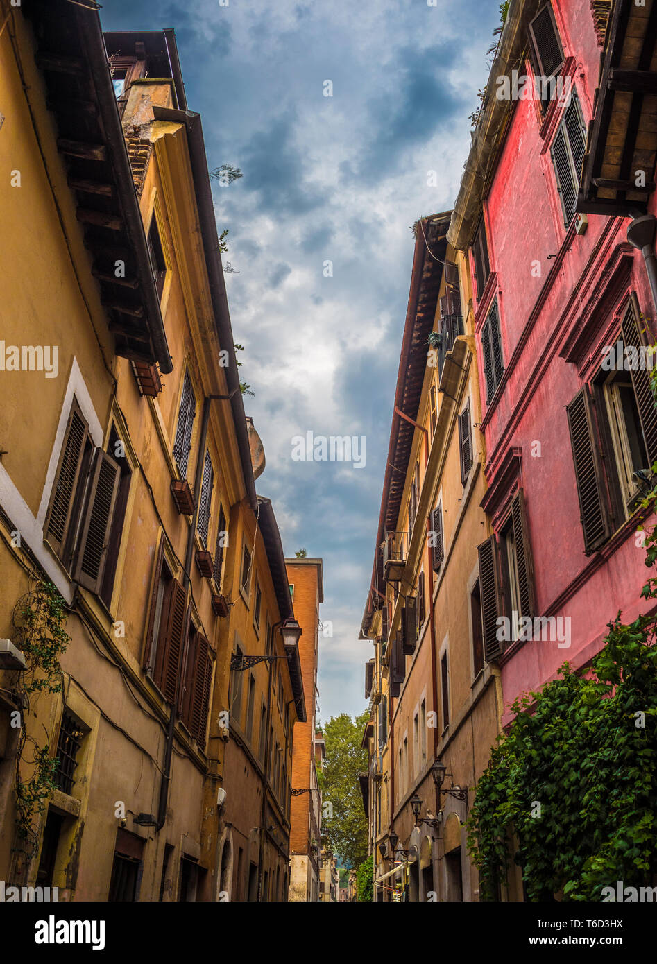 Typical buildings of the city while walking along the Lugaretta Street in Rome - Italy Stock Photo