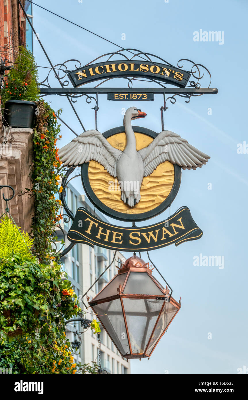 Ornate pub sign for The Swan public house in Hammersmith Broadway. Stock Photo