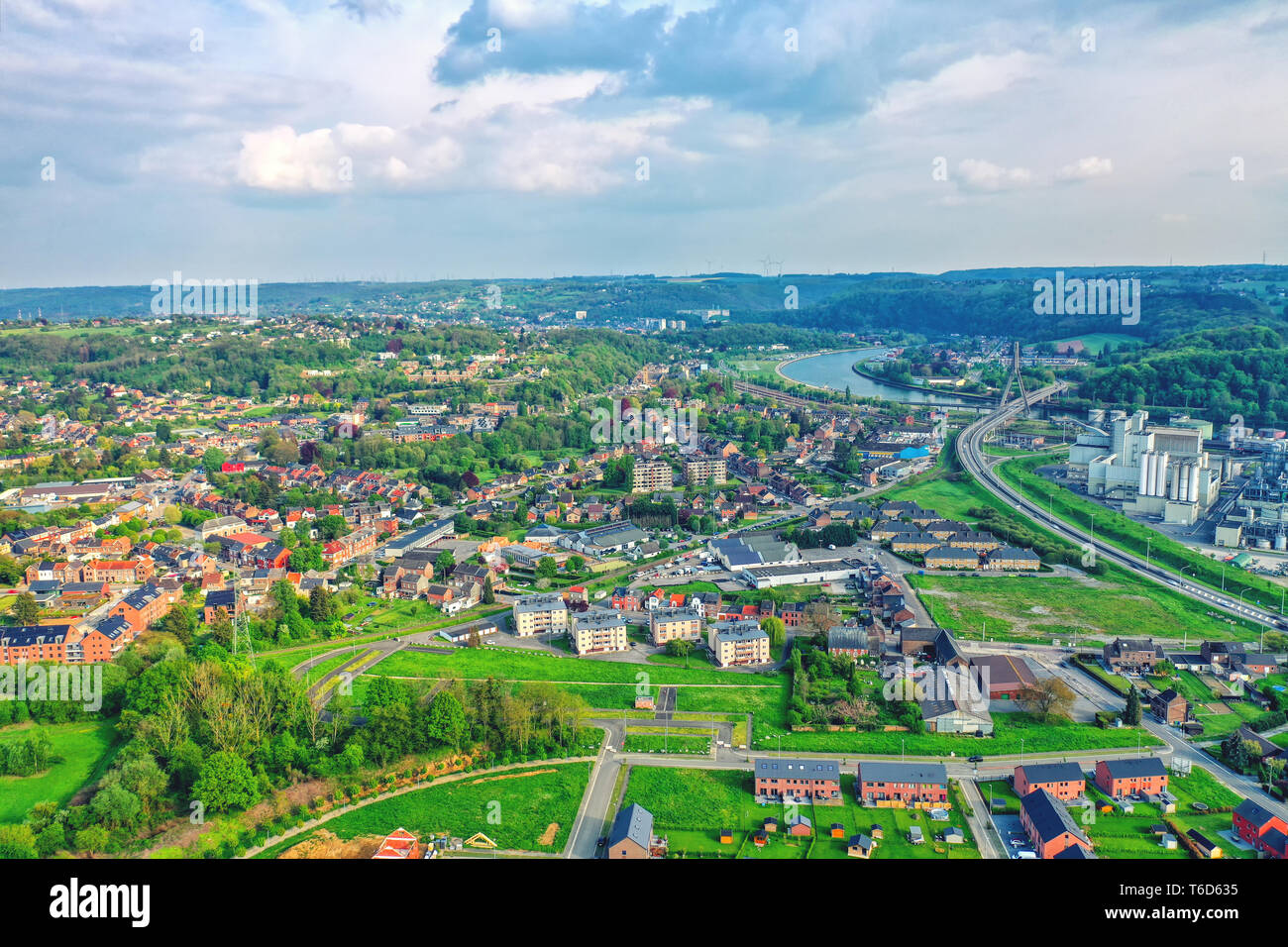 View over the city of Huy in Belgium and Meuse River to the distant nuclear power station of Tihange Stock Photo