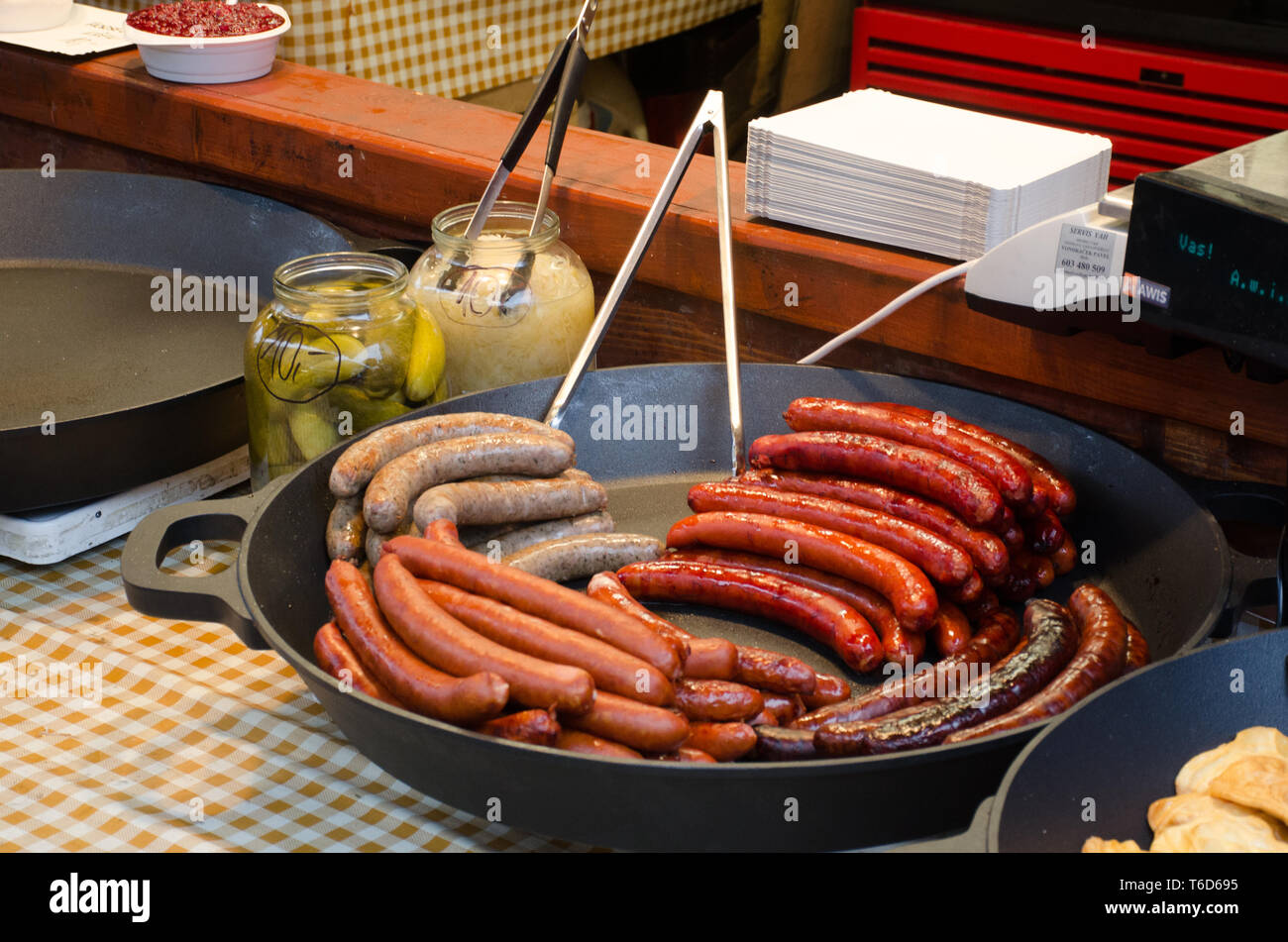 Large pan of kielbasa on sale on street Stall Stock Photo Alamy