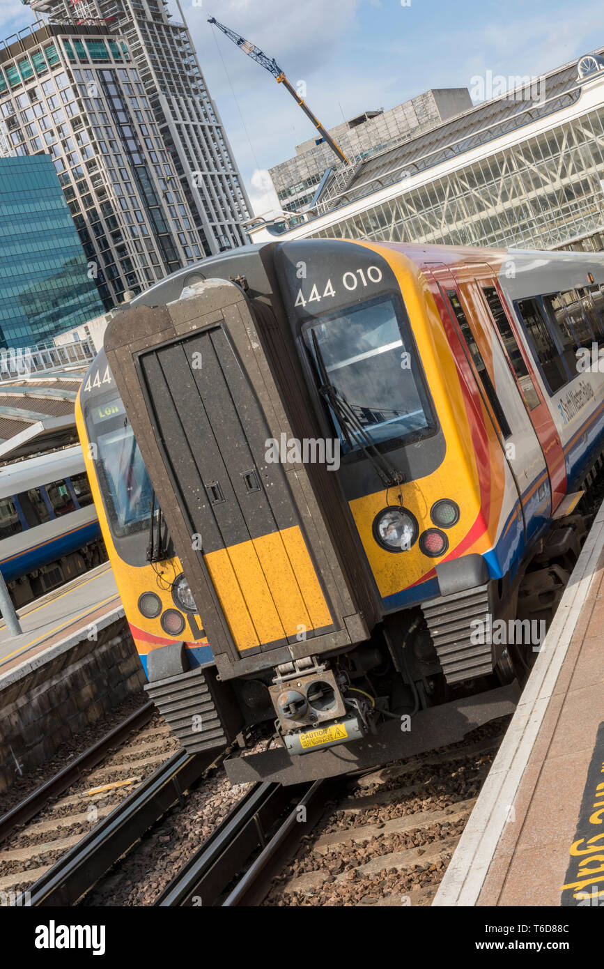 a south western railway class 444 electric multiple unit commuter train in a platform at London waterloo railway station. Stock Photo