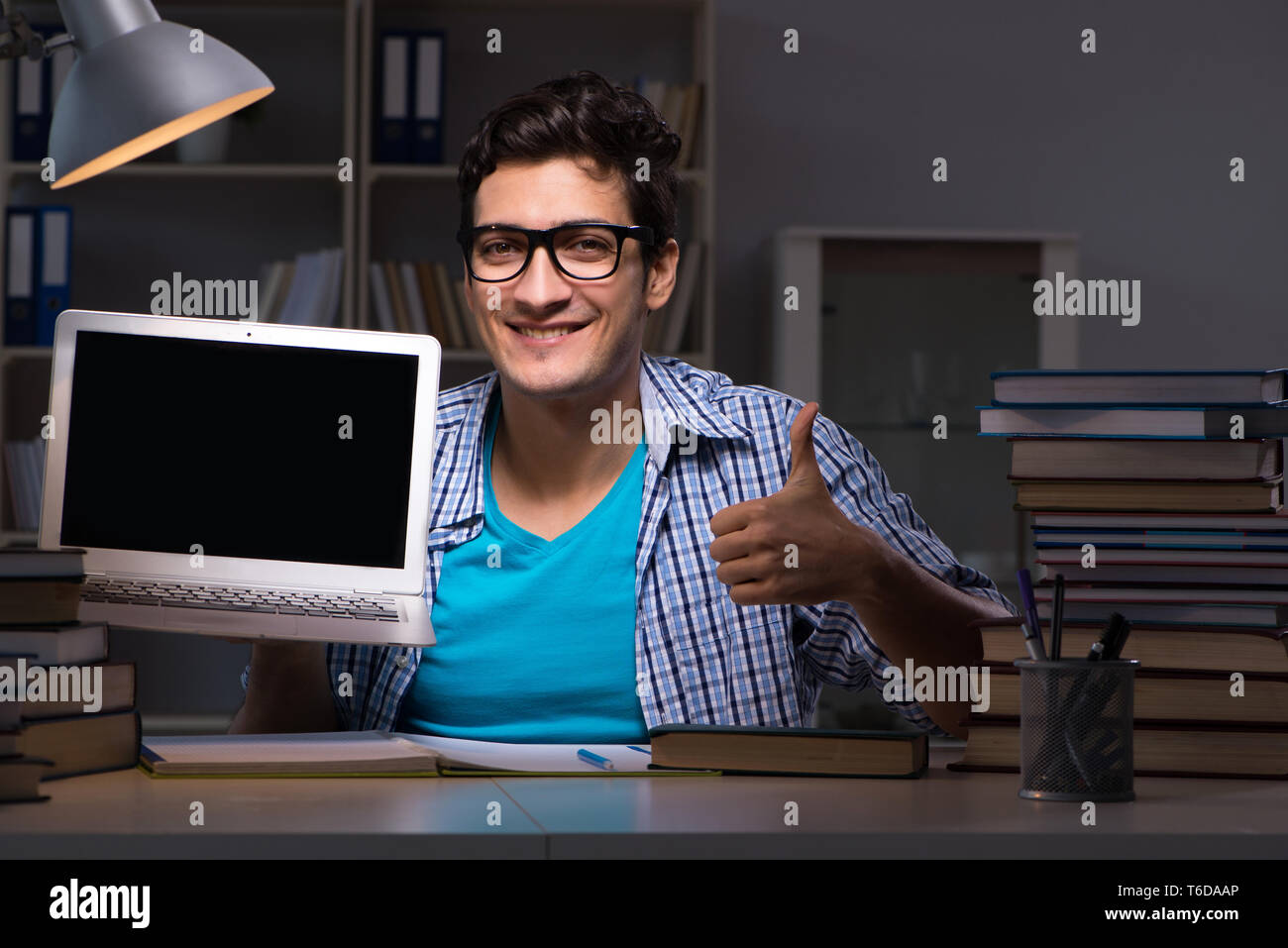 Student preparing for exams late night at home Stock Photo - Alamy