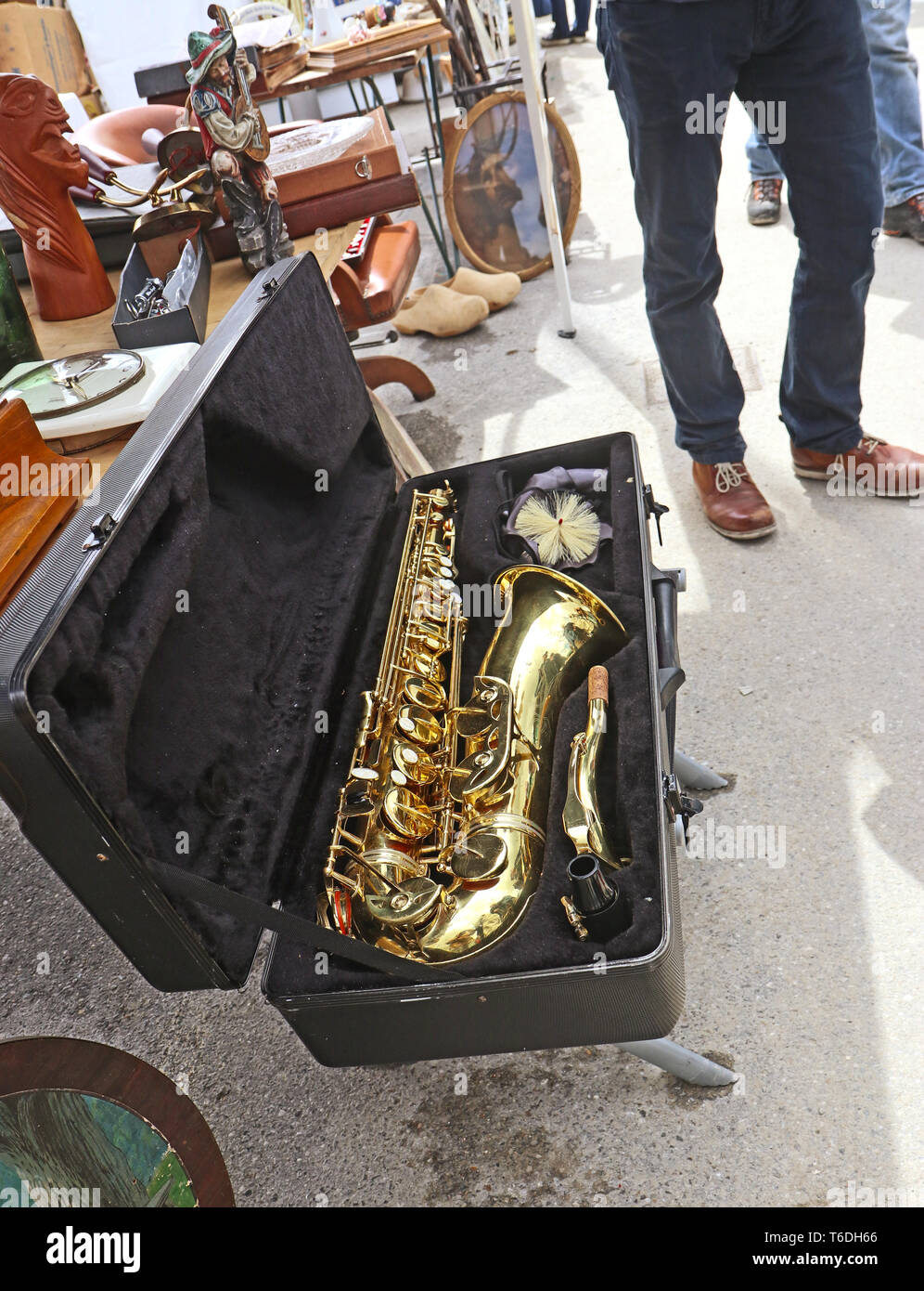 Shiny and golden alto saxophone on sell at the open air giant flea