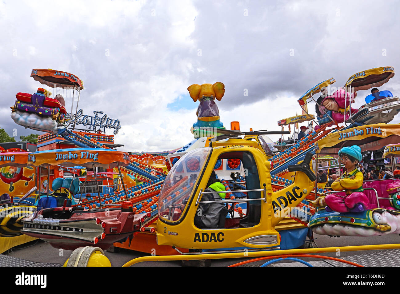 MUNICH, GERMANY - jump ride carousel at the spring festival in Munich,  fairground on the Theresienwiese with amusement park and many attractions  Stock Photo - Alamy