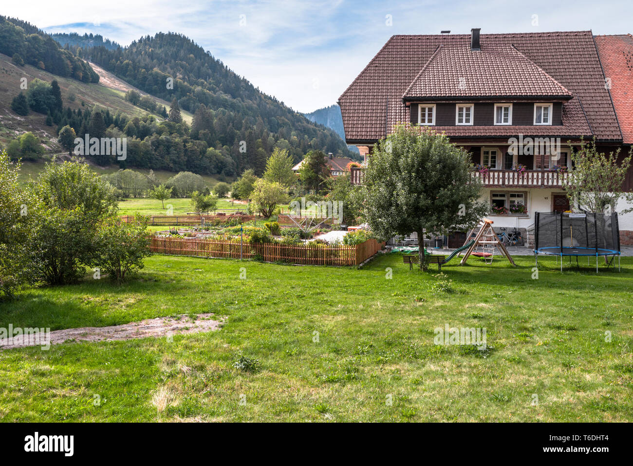 Black Forest houses and forest hills in the Southern Black Forest, spa health Menzenschwand, Germany, farm building High Black Forest near St. Blasien Stock Photo
