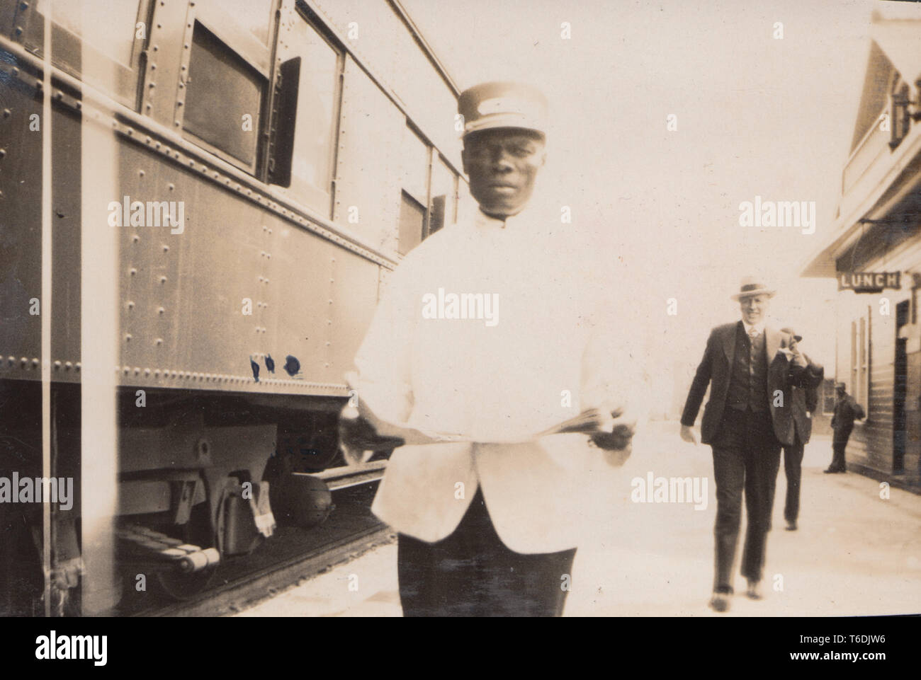 A Canadian Railways Train Attendant on The Platform of a Train Station in Canada. Stock Photo