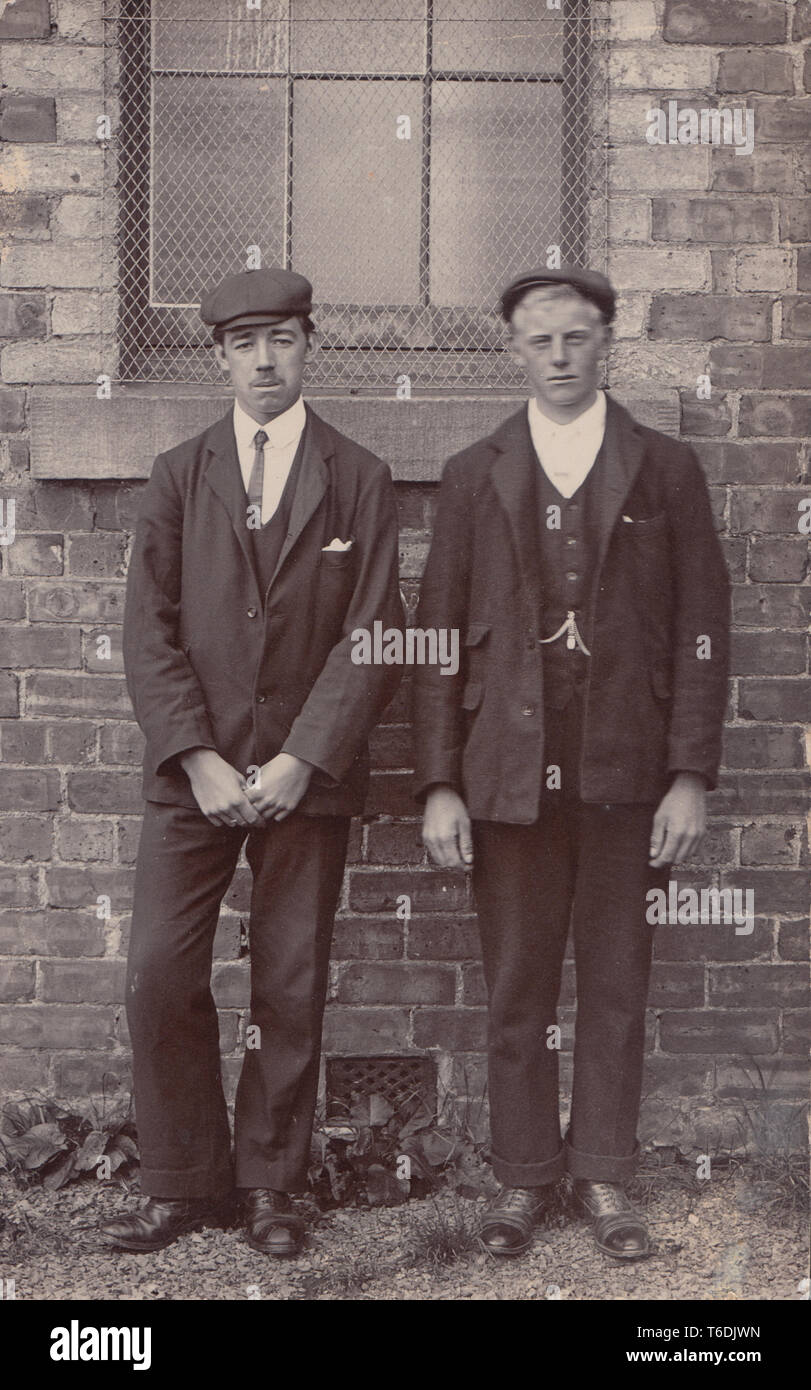 Vintage Photographic Portrait Postcard Showing Two Young Working Class Men. Possibly From East Lothian. Stock Photo