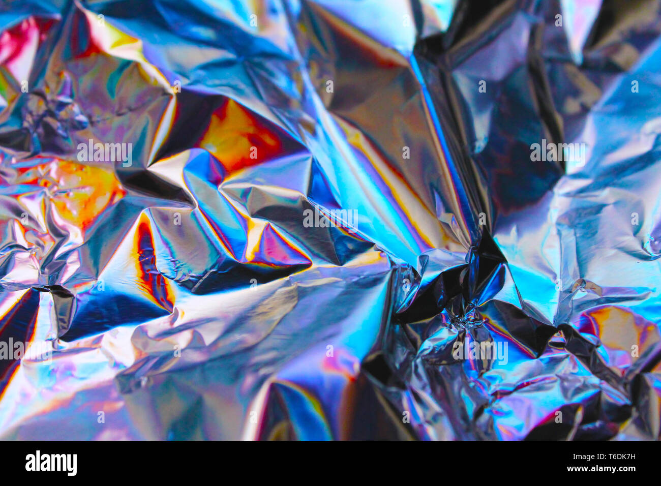 Photo texture of a fashionable holographic film. Abstract colorful  holographic futuristic texture Stock Photo by Okrasyuk