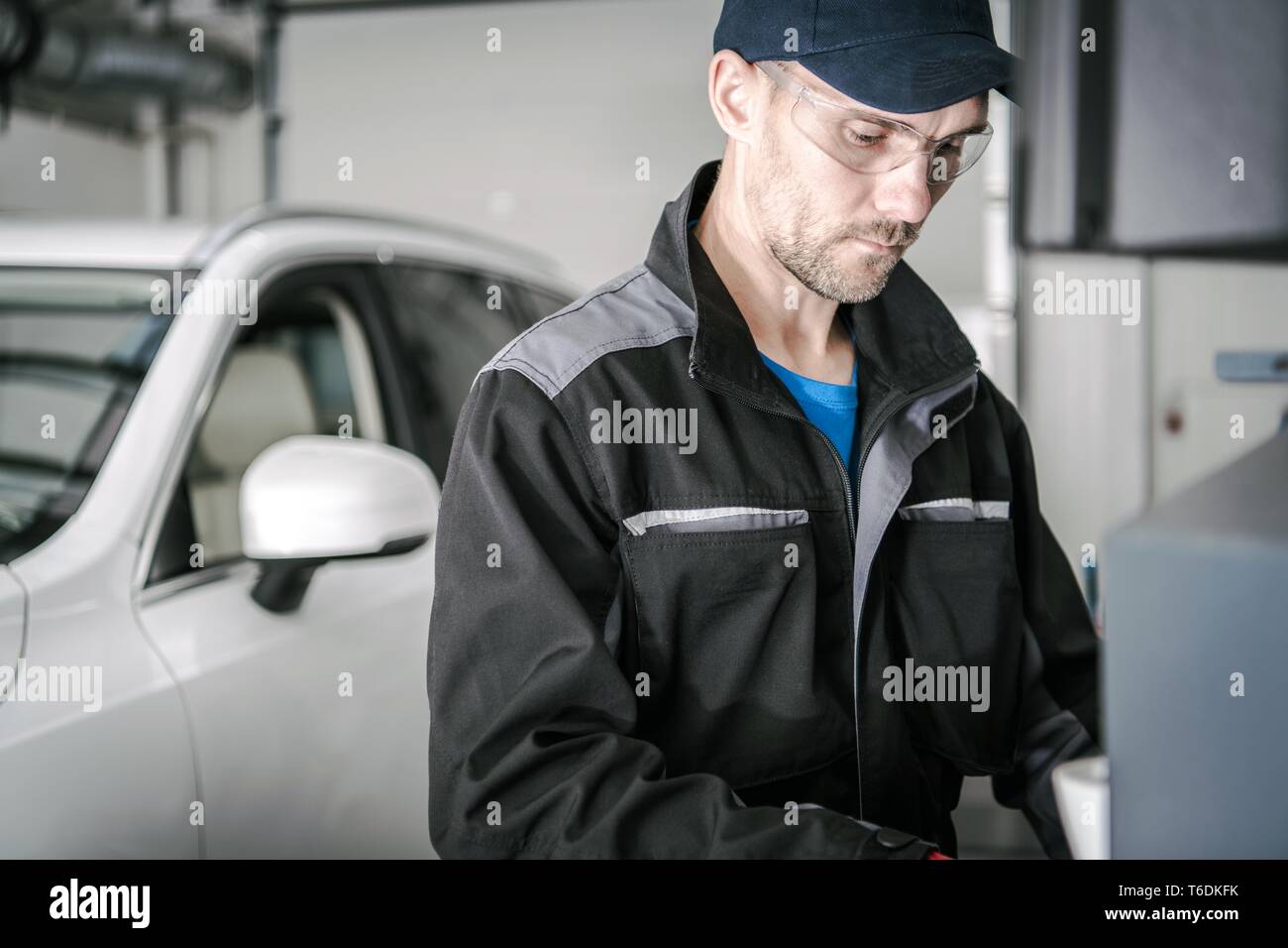 Transportation Industry Concept. Caucasian Car Mechanic in His 30s