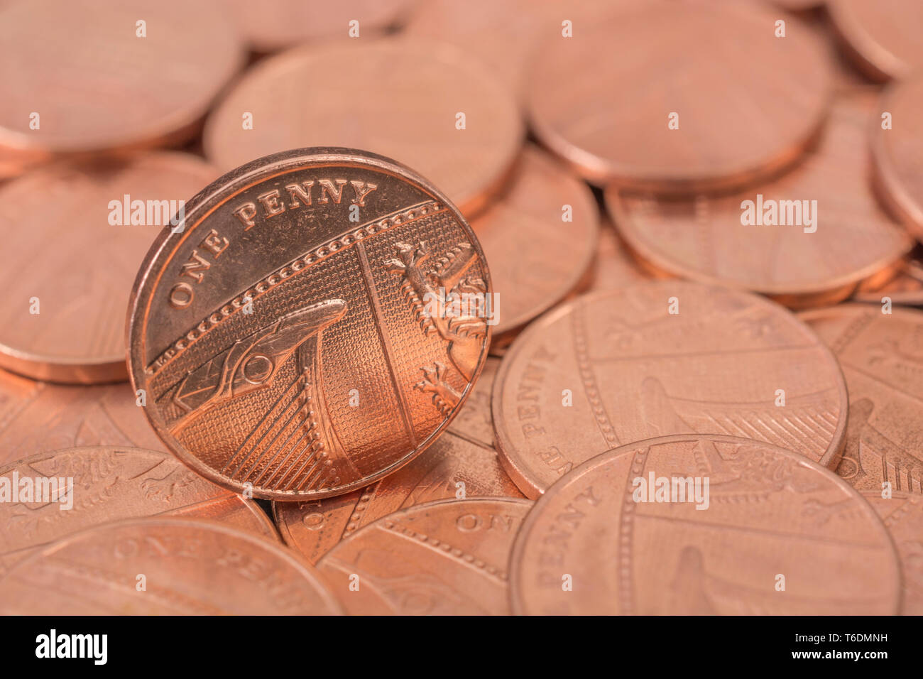 Macro close-up of British 1 Penny / 1p coin on bed pennies. Death of the penny, end of copper coins, penny withdrawal from circulation, Save the Penny Stock Photo